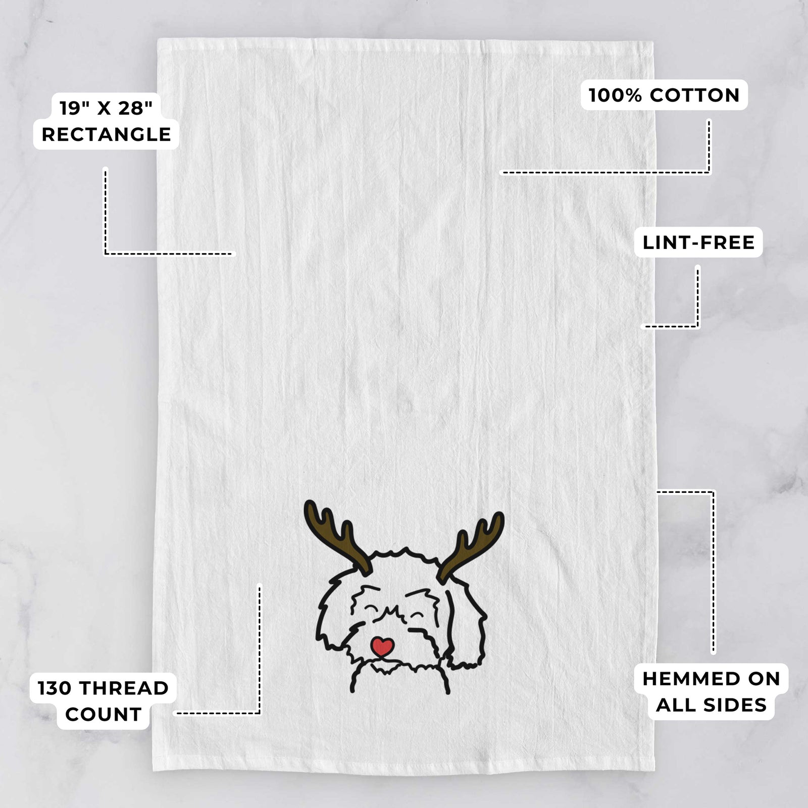 Minimalist line drawing of a Schnoodle with reindeer antlers and a red nose on a tea towel, with feature callouts: 19 x 28 inch rectangle, 100% cotton, lint-free, 120 thread count, hemmed on all sides