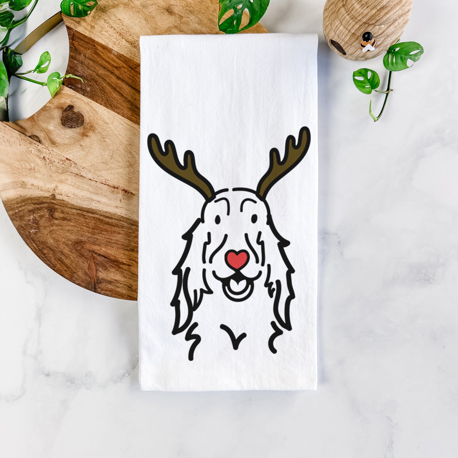 Minimalist line drawing of a Setter with reindeer antlers and a red nose on a tea towel