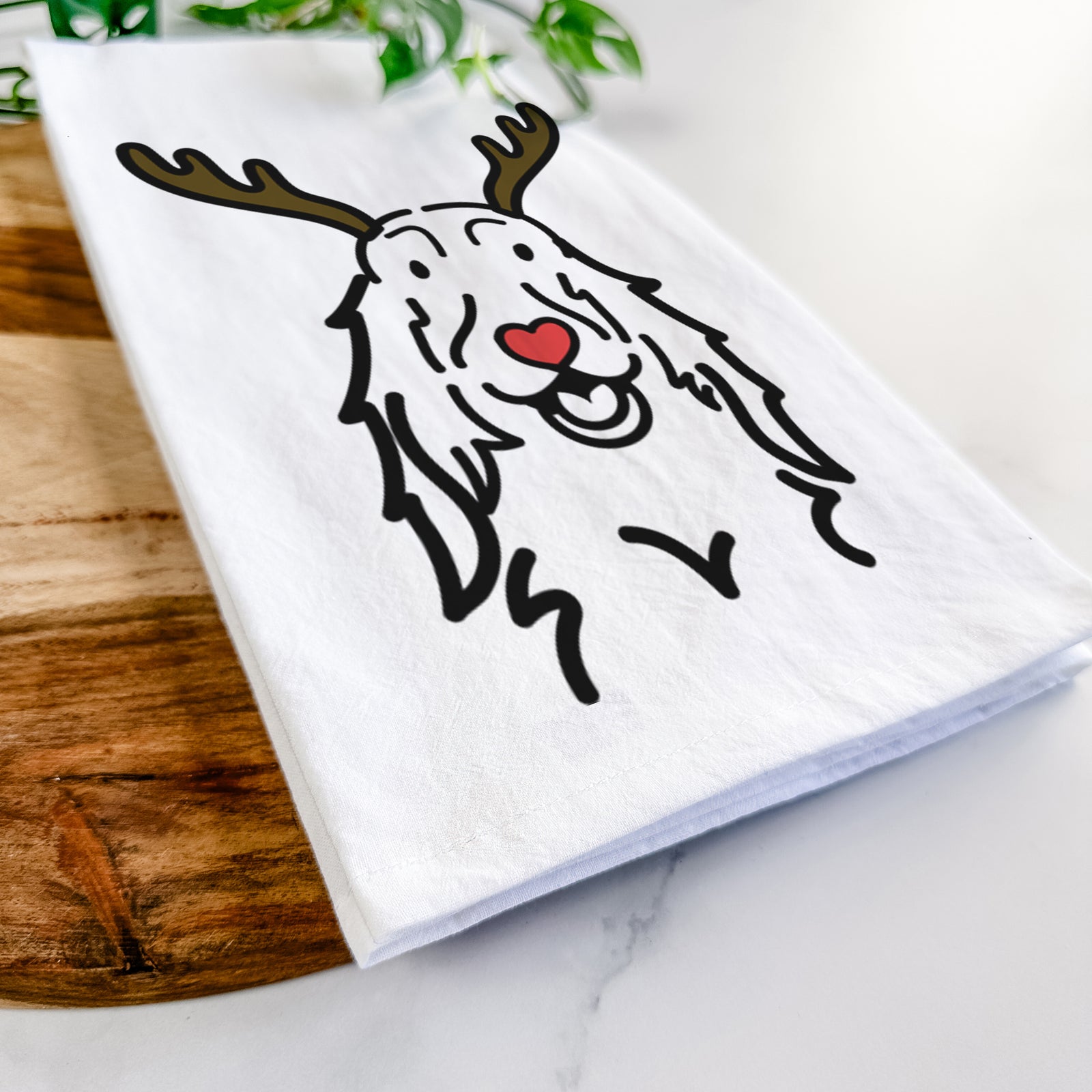 Minimalist line drawing of a Setter with reindeer antlers and a red nose on a tea towel