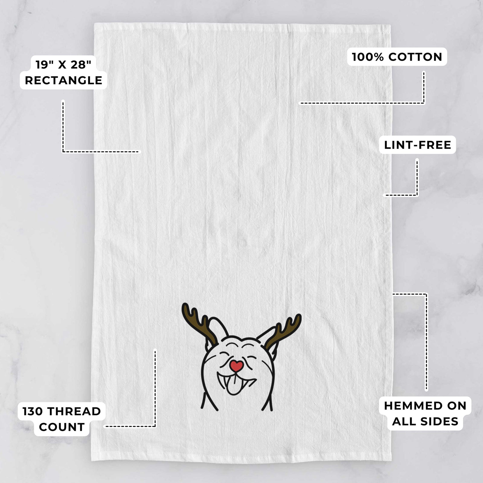 Minimalist line drawing of a Shiba Inu with reindeer antlers and a red nose on a tea towel, with feature callouts: 19 x 28 inch rectangle, 100% cotton, lint-free, 120 thread count, hemmed on all sides