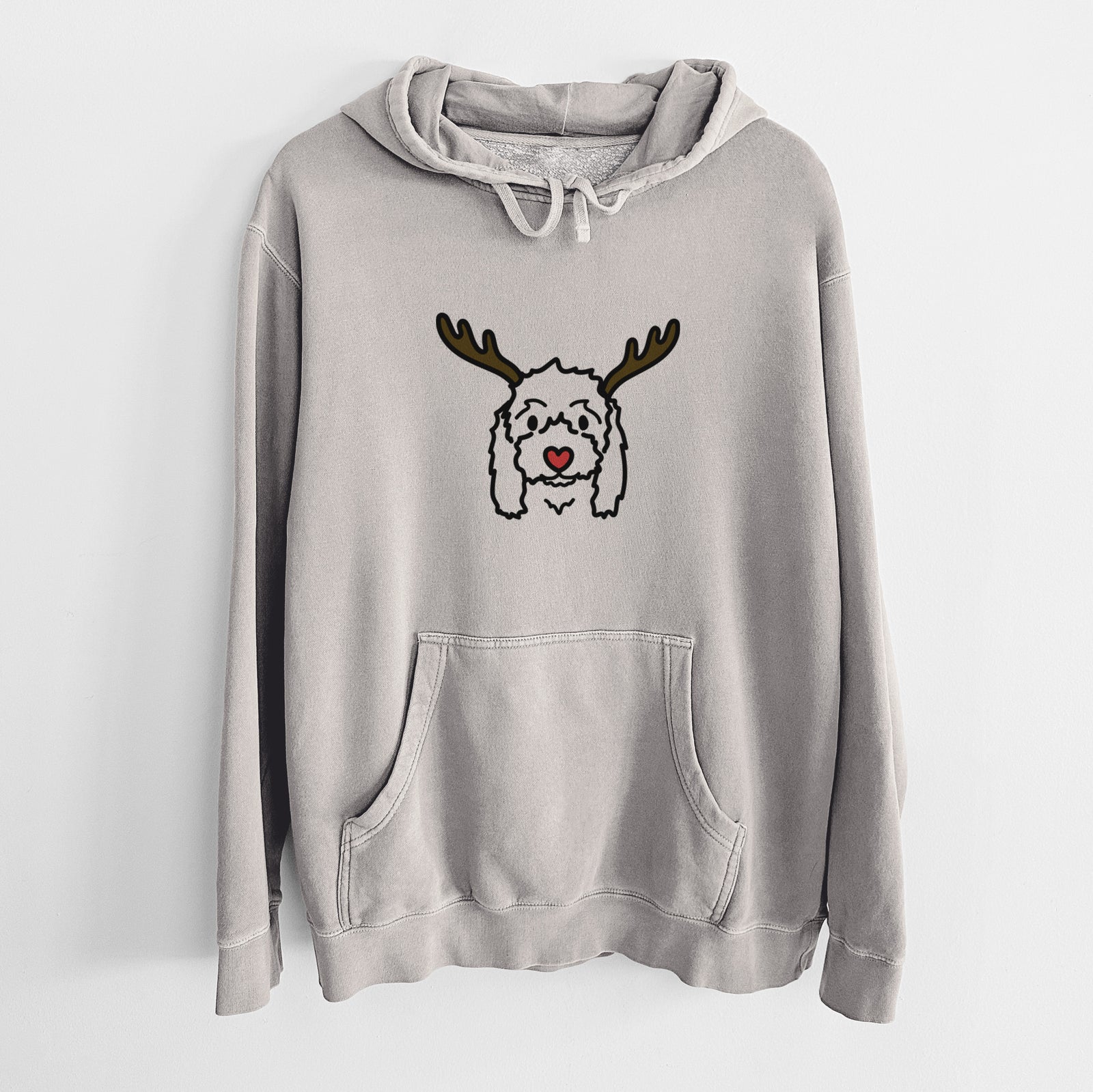 Minimalist line drawing of Sophie the Coton de Tulear with reindeer antlers and a red nose on a Cement Unisex pigment dyed hoodie