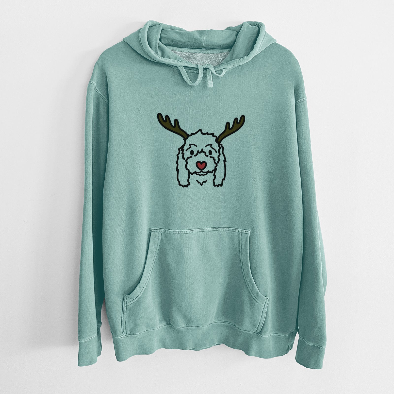 Minimalist line drawing of Sophie the Coton de Tulear with reindeer antlers and a red nose on a Mint Unisex pigment dyed hoodie