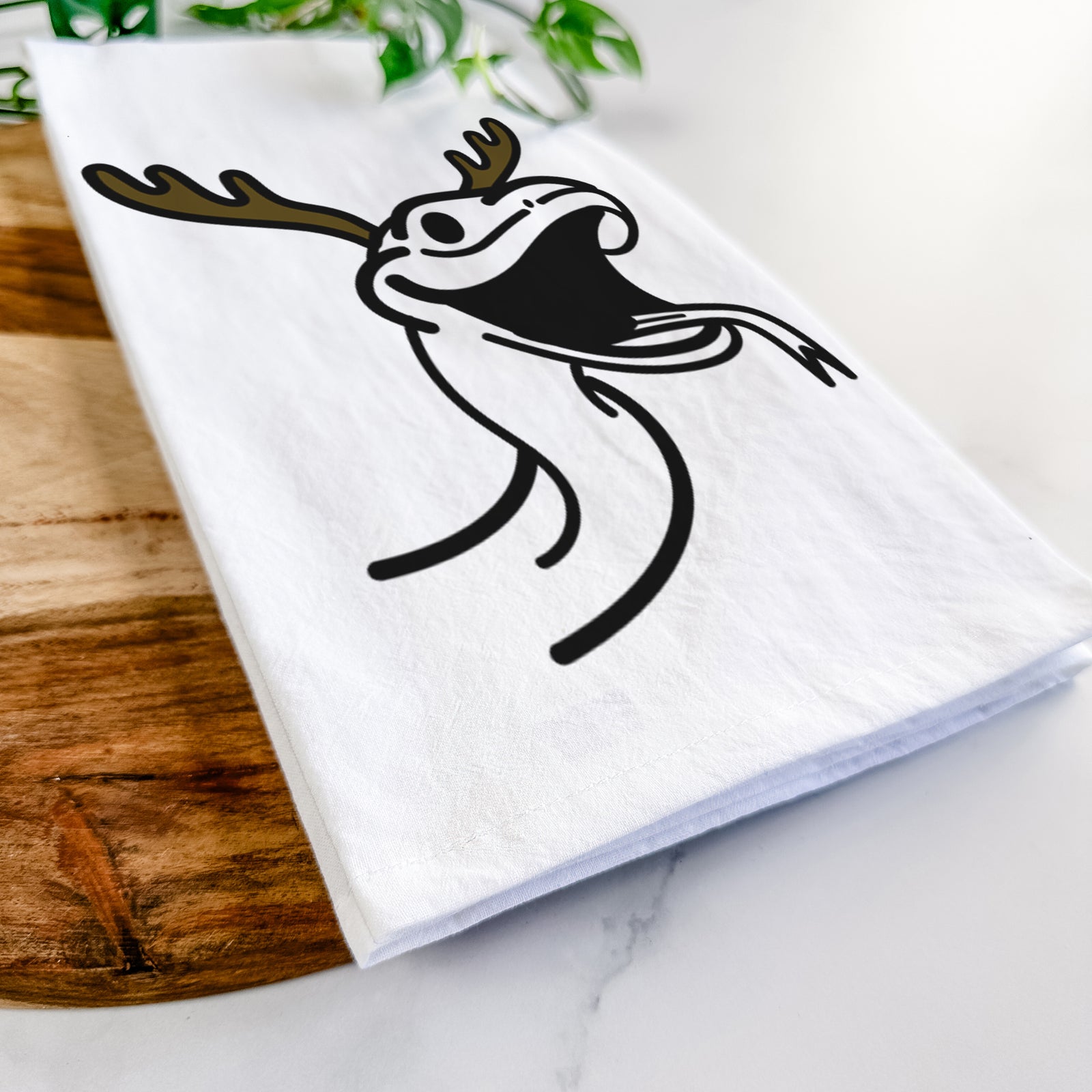 Minimalist line drawing of Spike the Snake with reindeer antlers and a red nose on a tea towel
