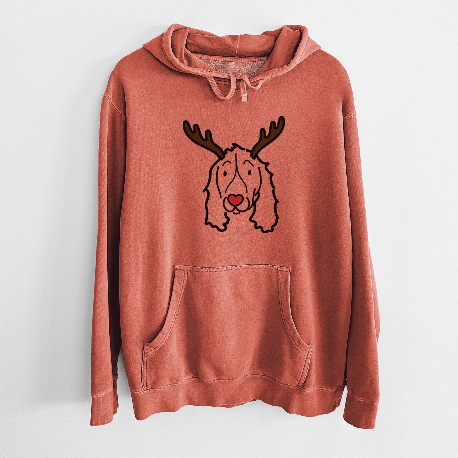 Minimalist line drawing of an English Springer Spaniel with reindeer antlers and a red nose on an Amber Unisex pigment dyed hoodie