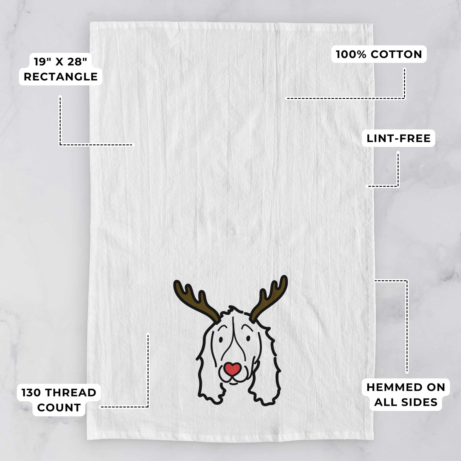 Minimalist line drawing of an English Springer Spaniel with reindeer antlers and a red nose on a tea towel, with feature callouts: 19 x 28 inch rectangle, 100% cotton, lint-free, 120 thread count, hemmed on all sides