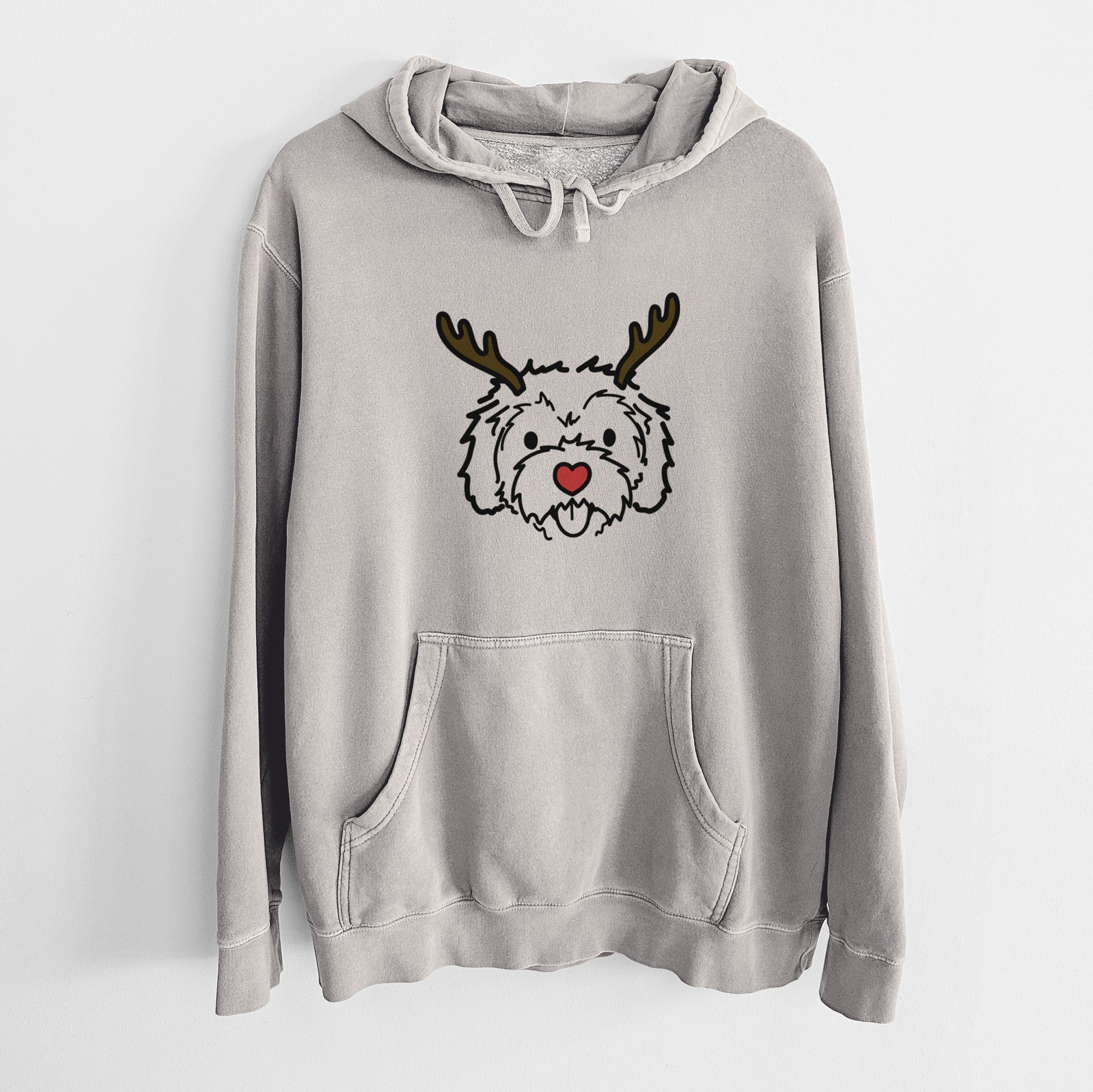 Minimalist line drawing of Sprinkles the Cockapoo with reindeer antlers and a red nose on a Cement Unisex pigment dyed hoodie