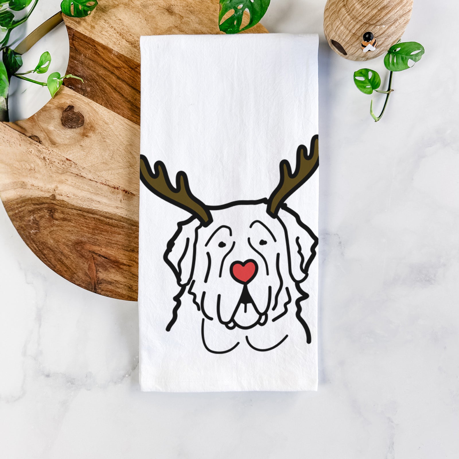 Minimalist line drawing of a Saint Bernard with reindeer antlers and a red nose on a tea towel
