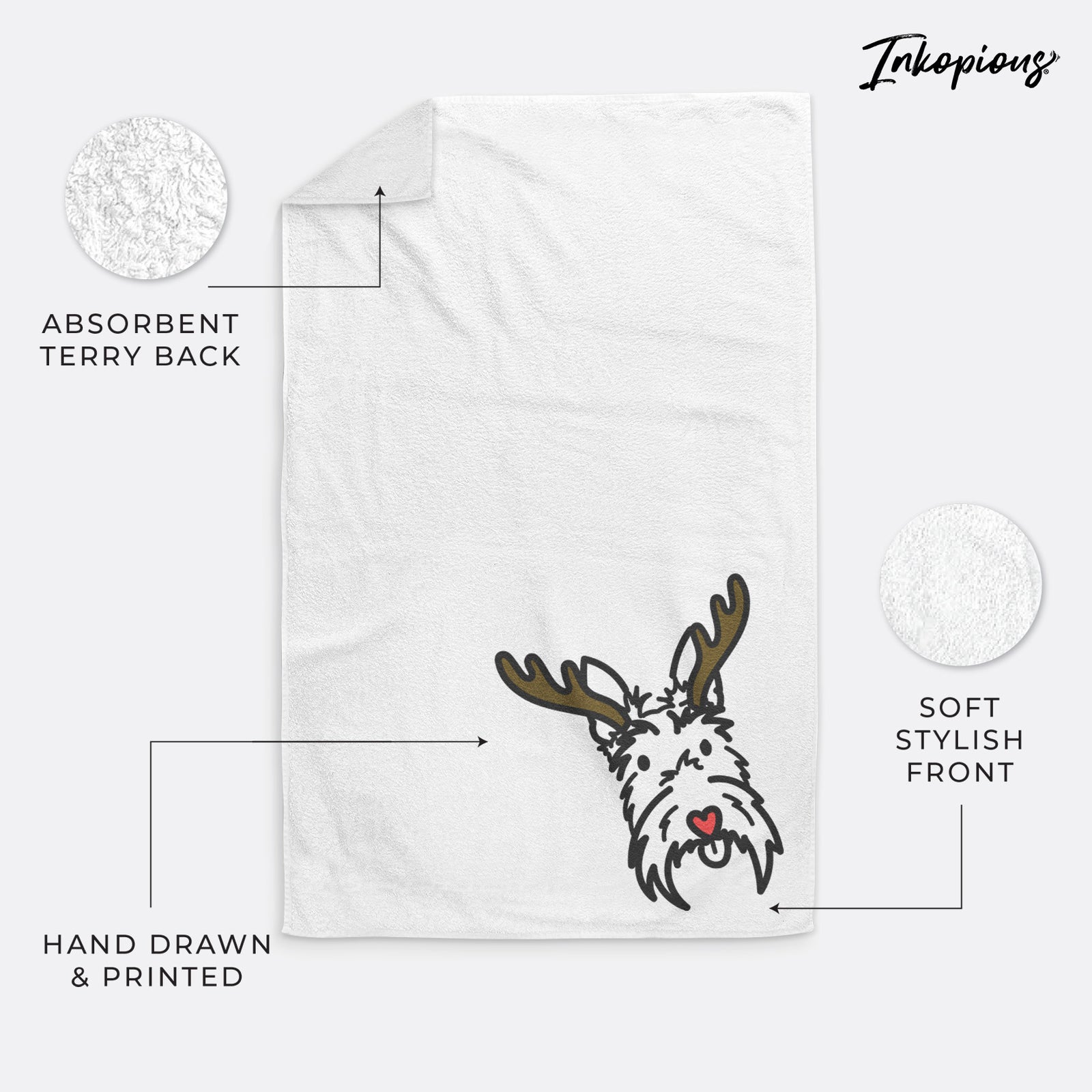 Minimalist line drawing of Thistle the Scottish Terrier with reindeer antlers and a red nose on a decorative hand towel