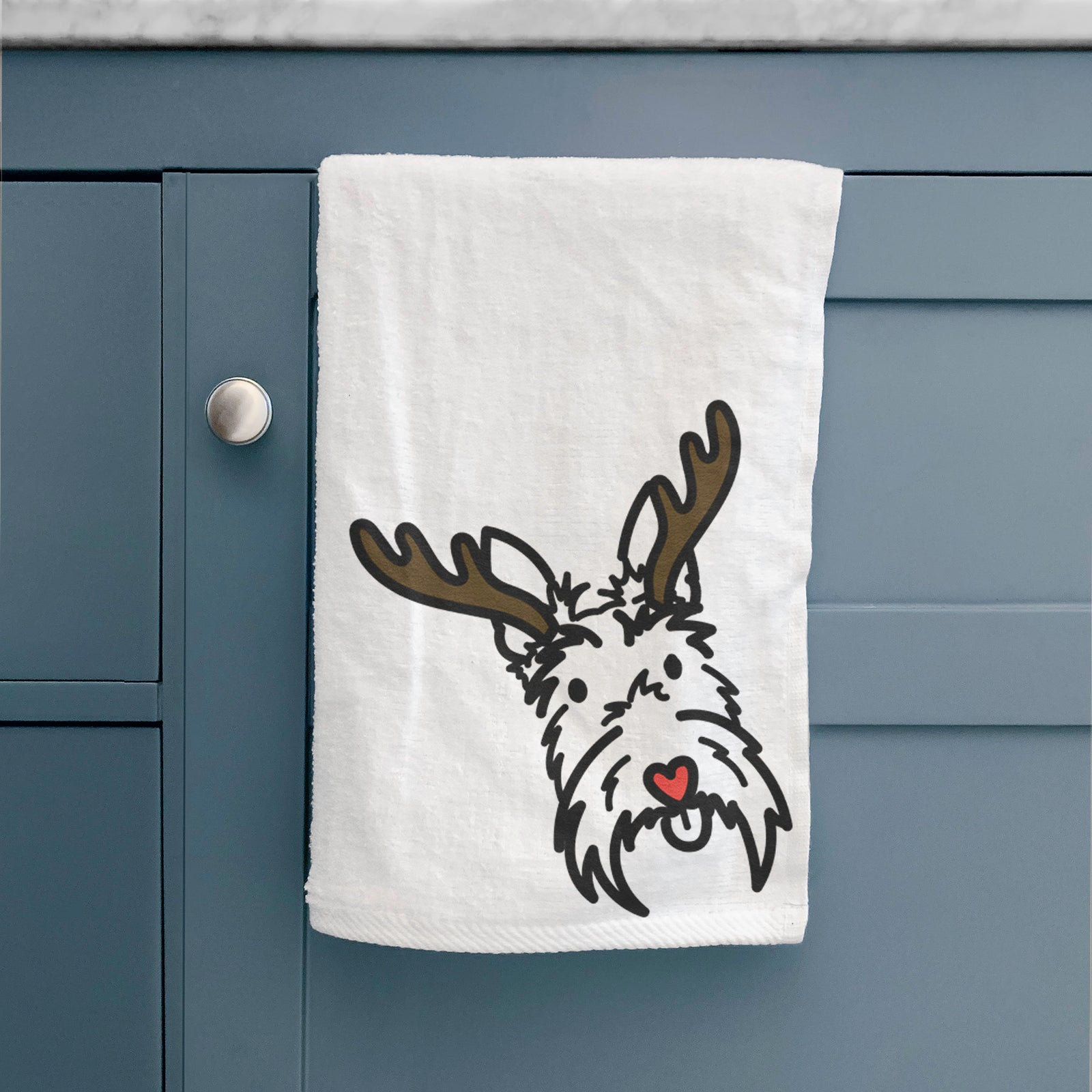 Minimalist line drawing of Thistle the Scottish Terrier with reindeer antlers and a red nose on a decorative hand towel