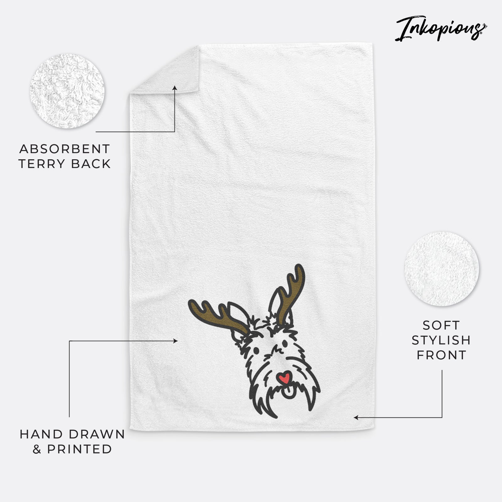 Minimalist line drawing of Thistle the Scottish Terrier with reindeer antlers and a red nose on a decorative hand towel