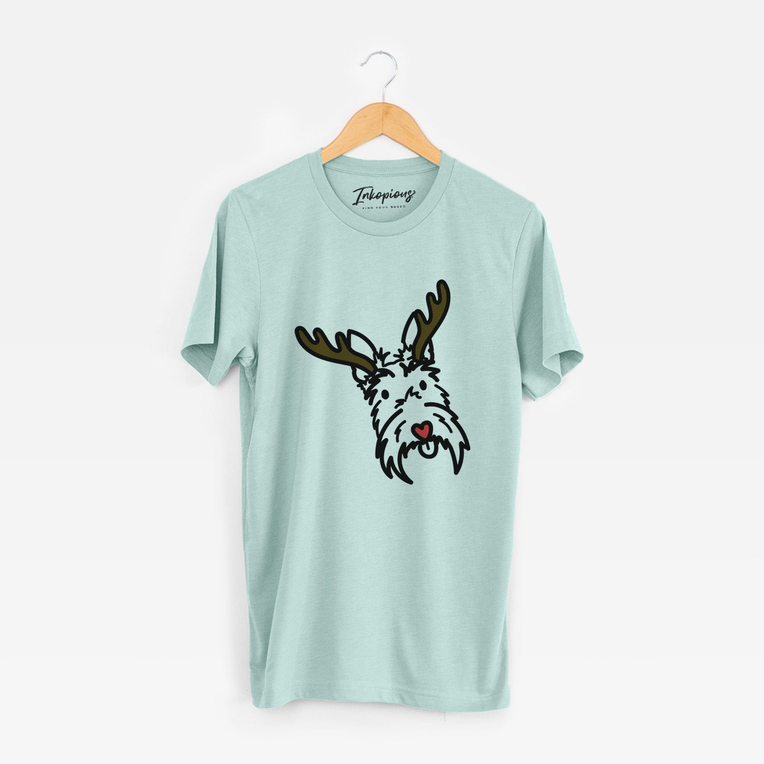 Minimalist line drawing of Thistle the Scottish Terrier with reindeer antlers and a red nose on a Heather Sage Unisex crewneck