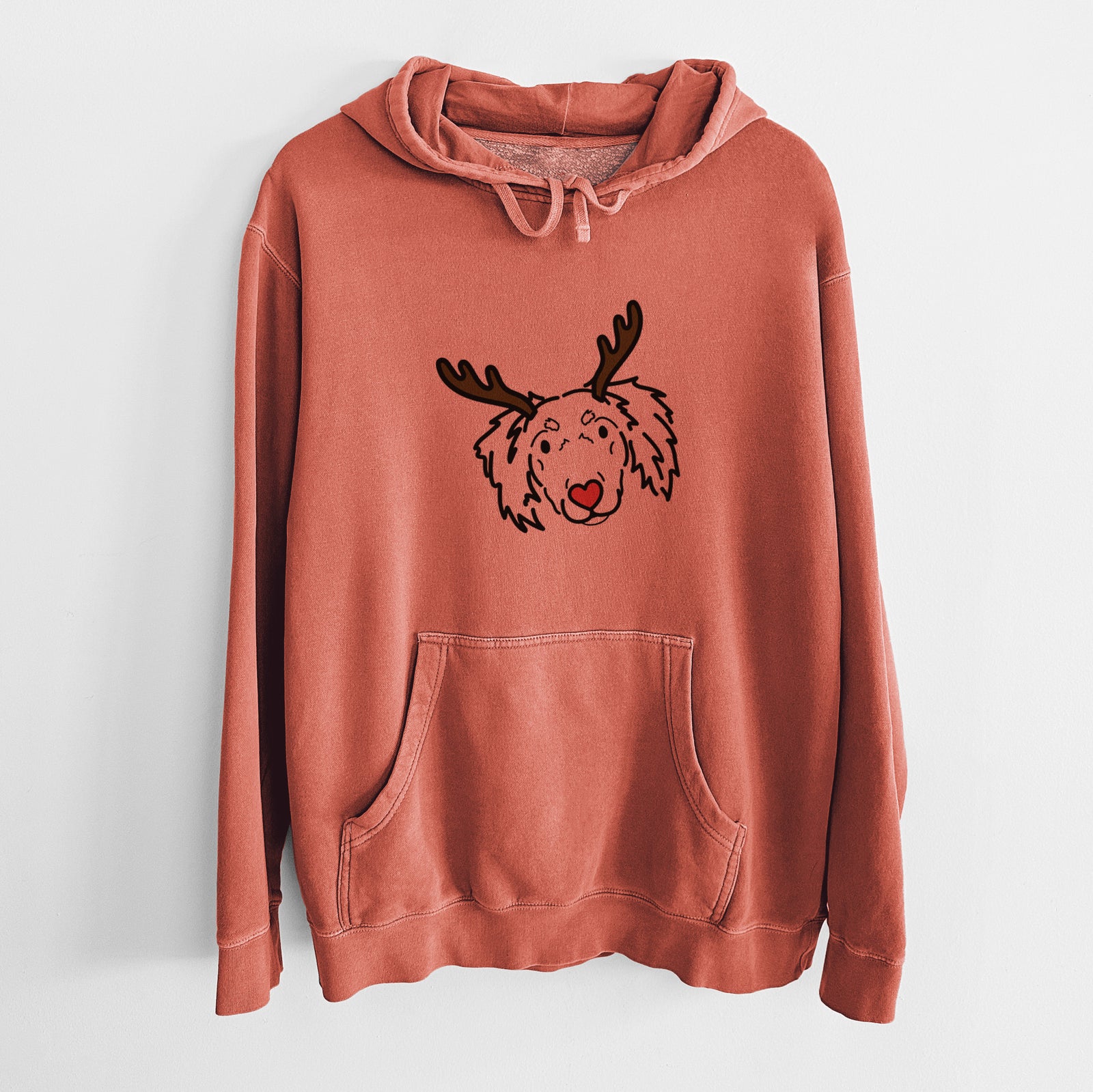 Minimalist line drawing of Tilly the Dachshund Mix with reindeer antlers and a red nose on an Amber Unisex pigment dyed hoodie