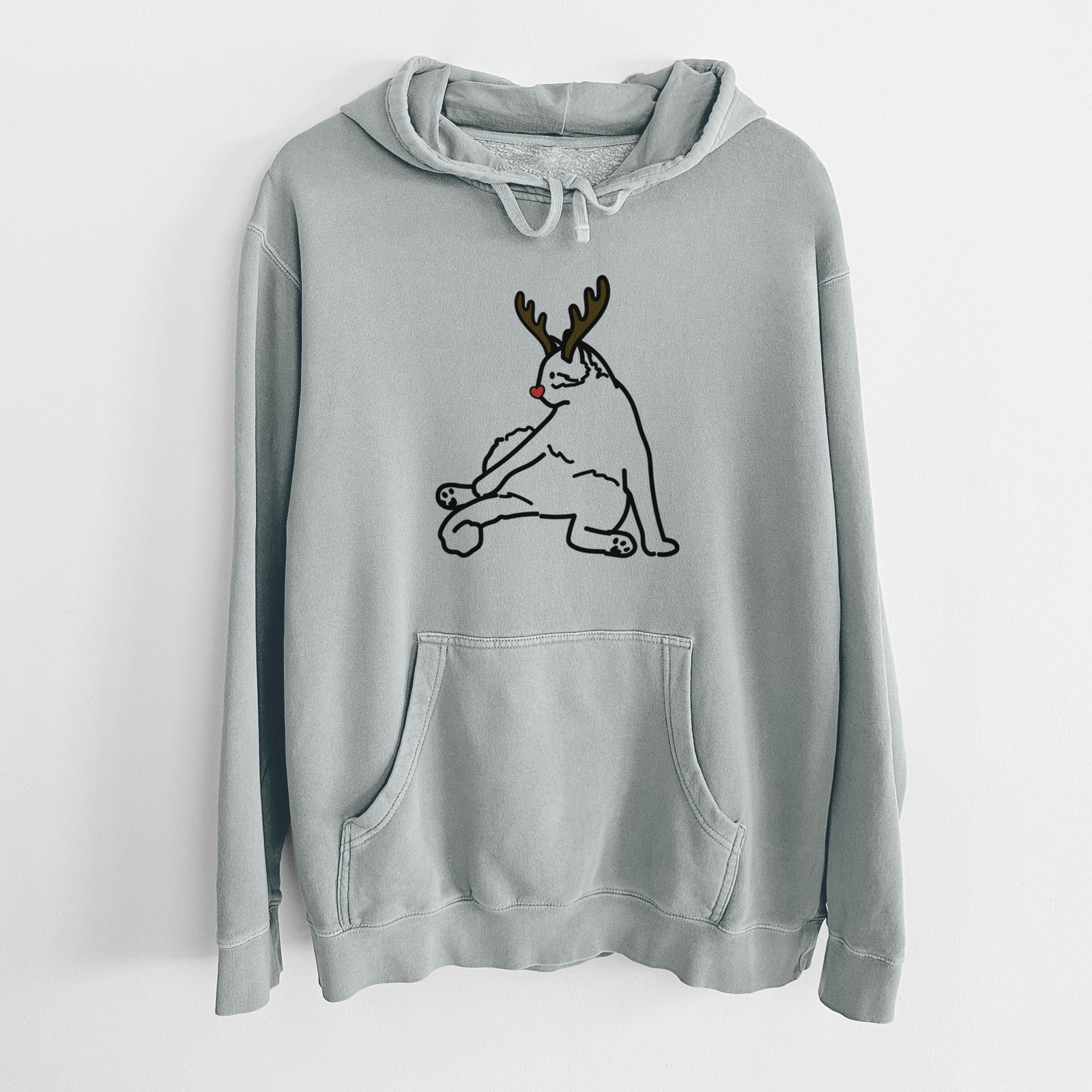 Minimalist line drawing of Tom the Cat with reindeer antlers and a red nose on a Sage Unisex pigment dyed hoodie