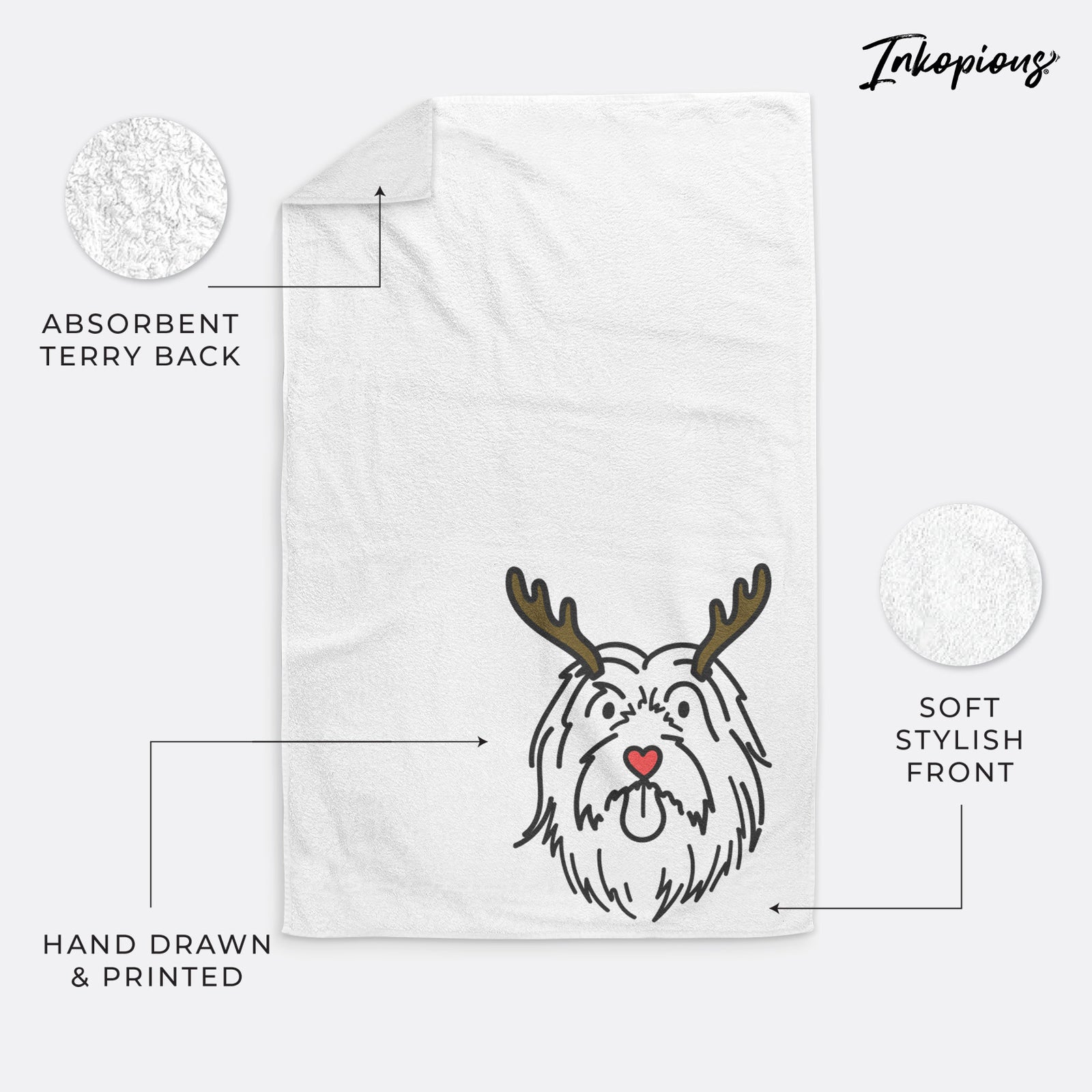 Minimalist line drawing of Tucker the Bearded Collie with reindeer antlers and a red nose on a decorative hand towel
