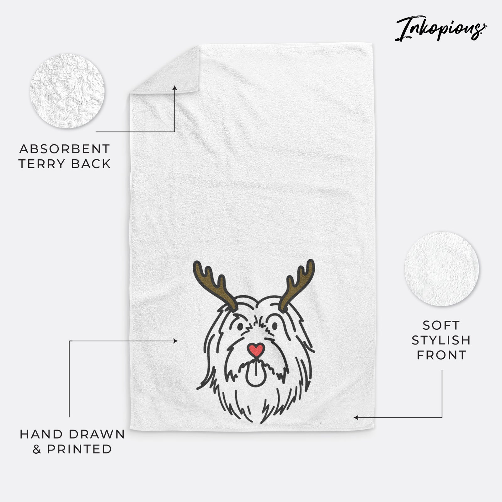 Minimalist line drawing of Tucker the Bearded Collie with reindeer antlers and a red nose on a decorative hand towel