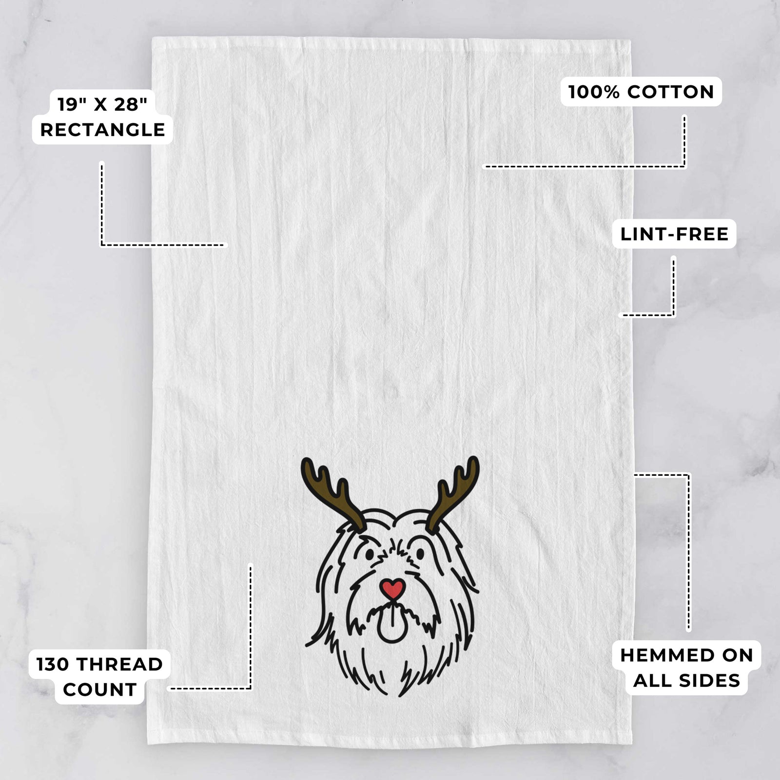 Minimalist line drawing of Tucker the Bearded Collie with reindeer antlers and a red nose on a tea towel, with feature callouts: 19 x 28 inch rectangle, 100% cotton, lint-free, 120 thread count, hemmed on all sides