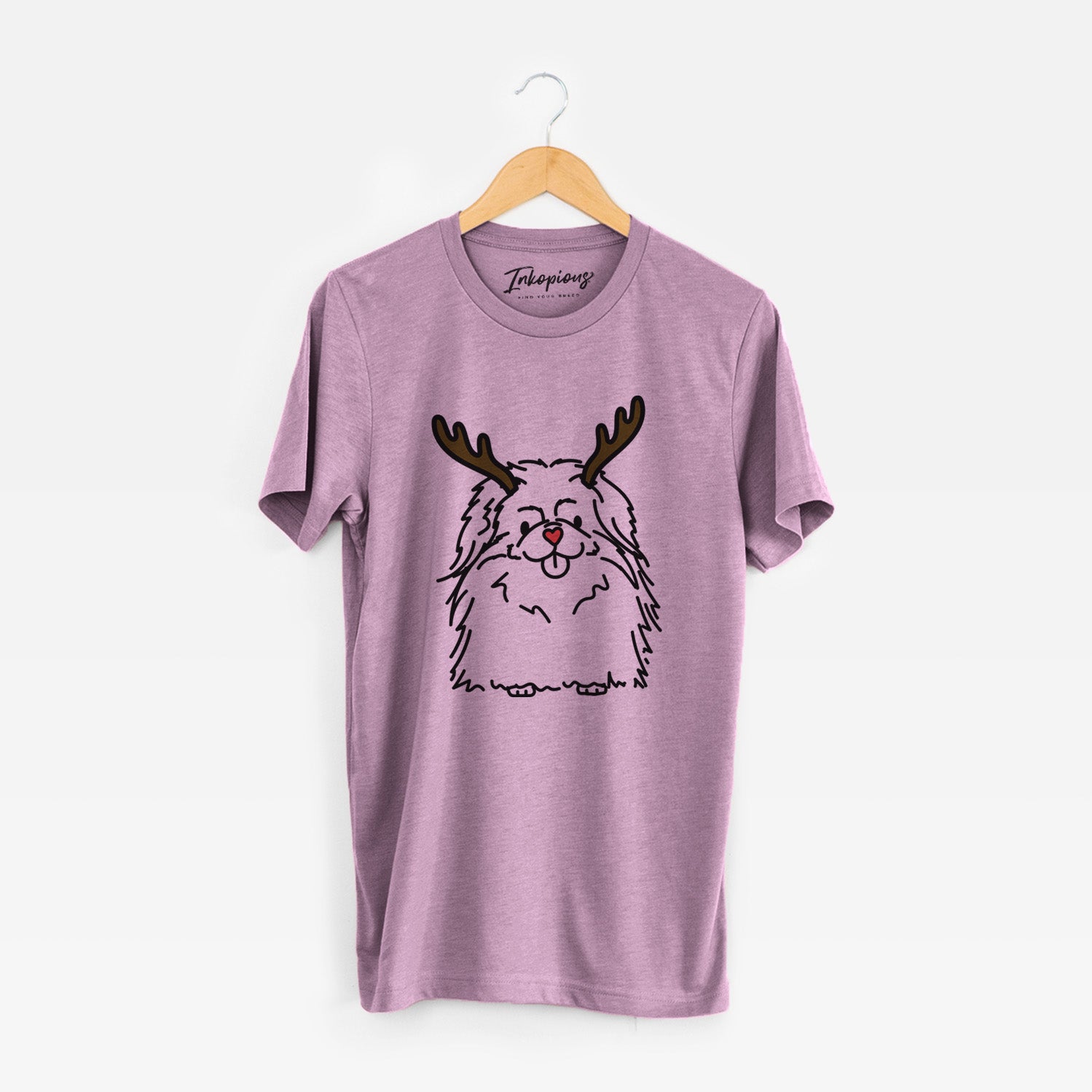 Minimalist line drawing of Viv the Pekingese with reindeer antlers and a red nose on an Orchid Unisex crewneck