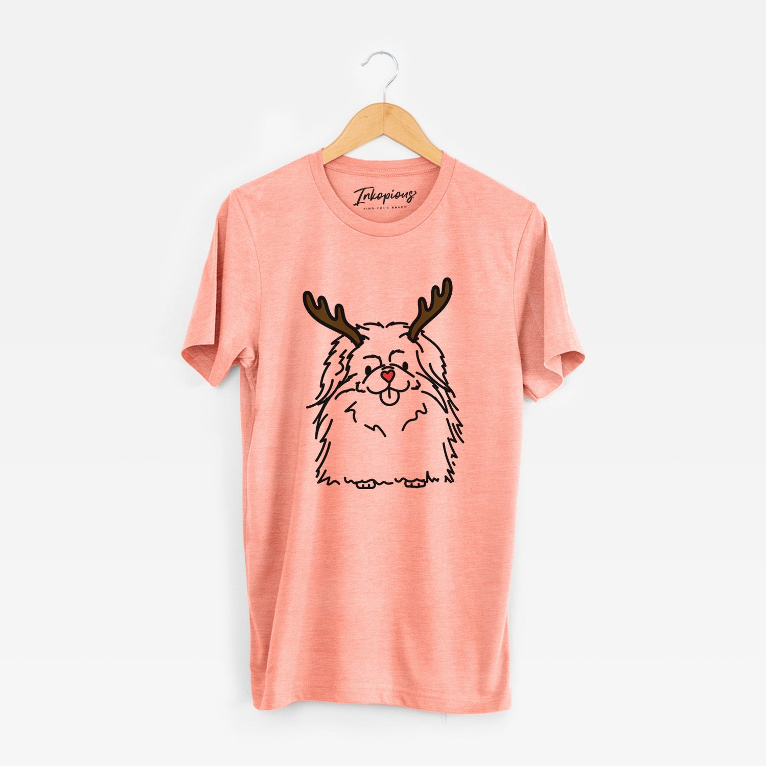 Minimalist line drawing of Viv the Pekingese with reindeer antlers and a red nose on a Sunset Unisex crewneck