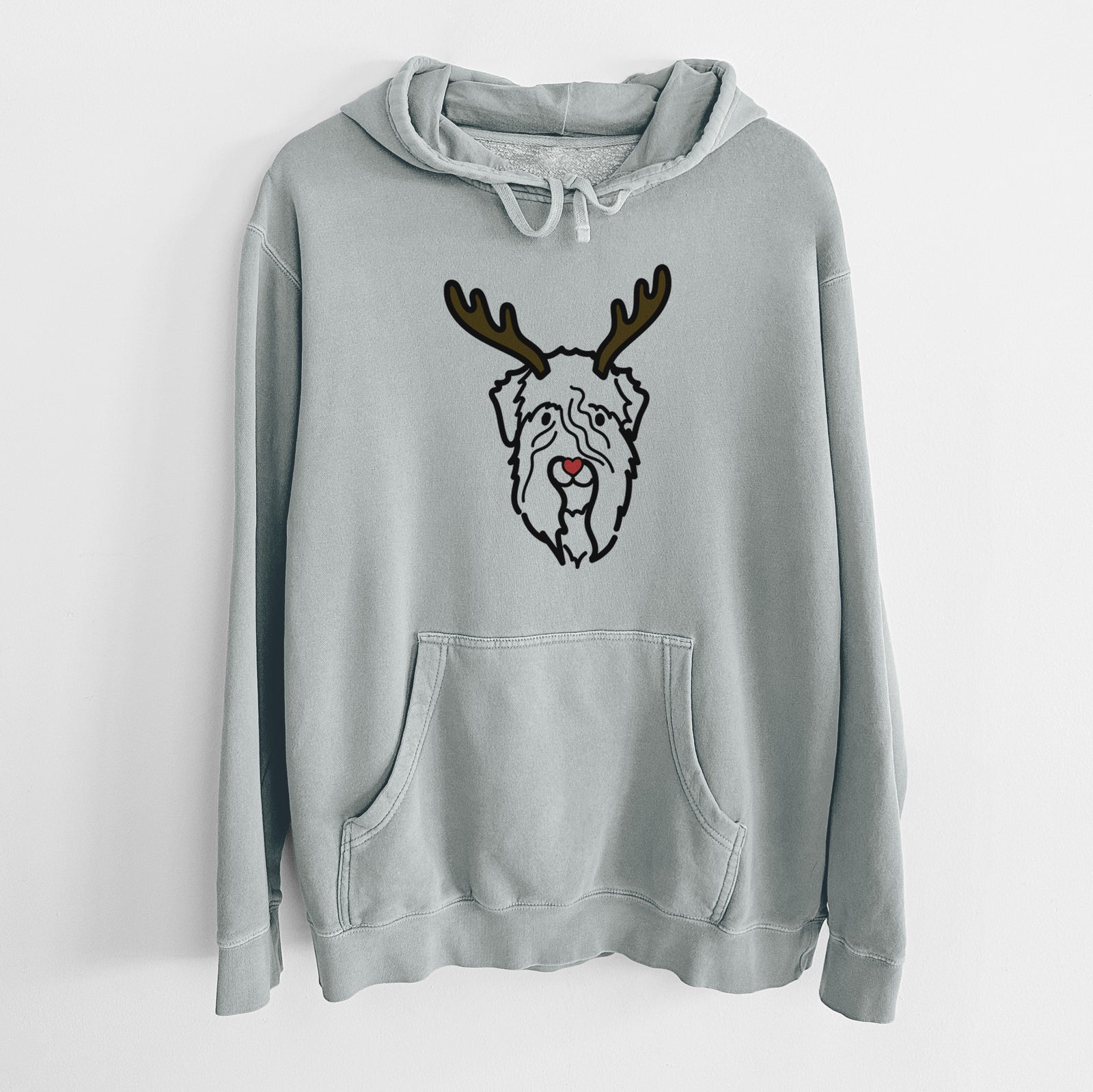 Minimalist line drawing of a Soft Coated Wheaten Terrier with reindeer antlers and a red nose on a Sage Unisex pigment dyed hoodie