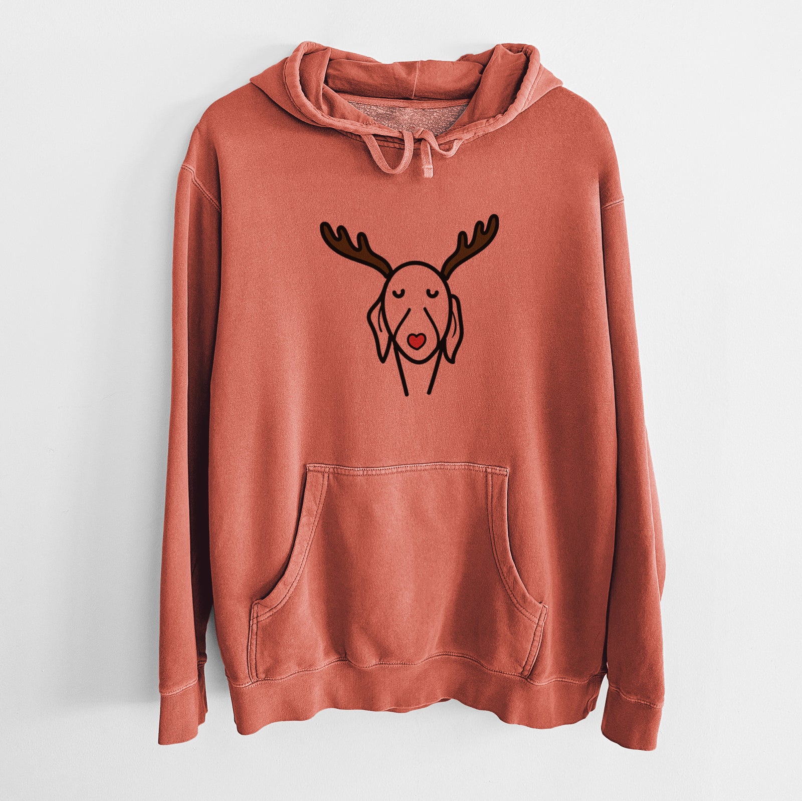 Minimalist line drawing of a Whippet with reindeer antlers and a red nose on an Amber Unisex pigment dyed hoodie