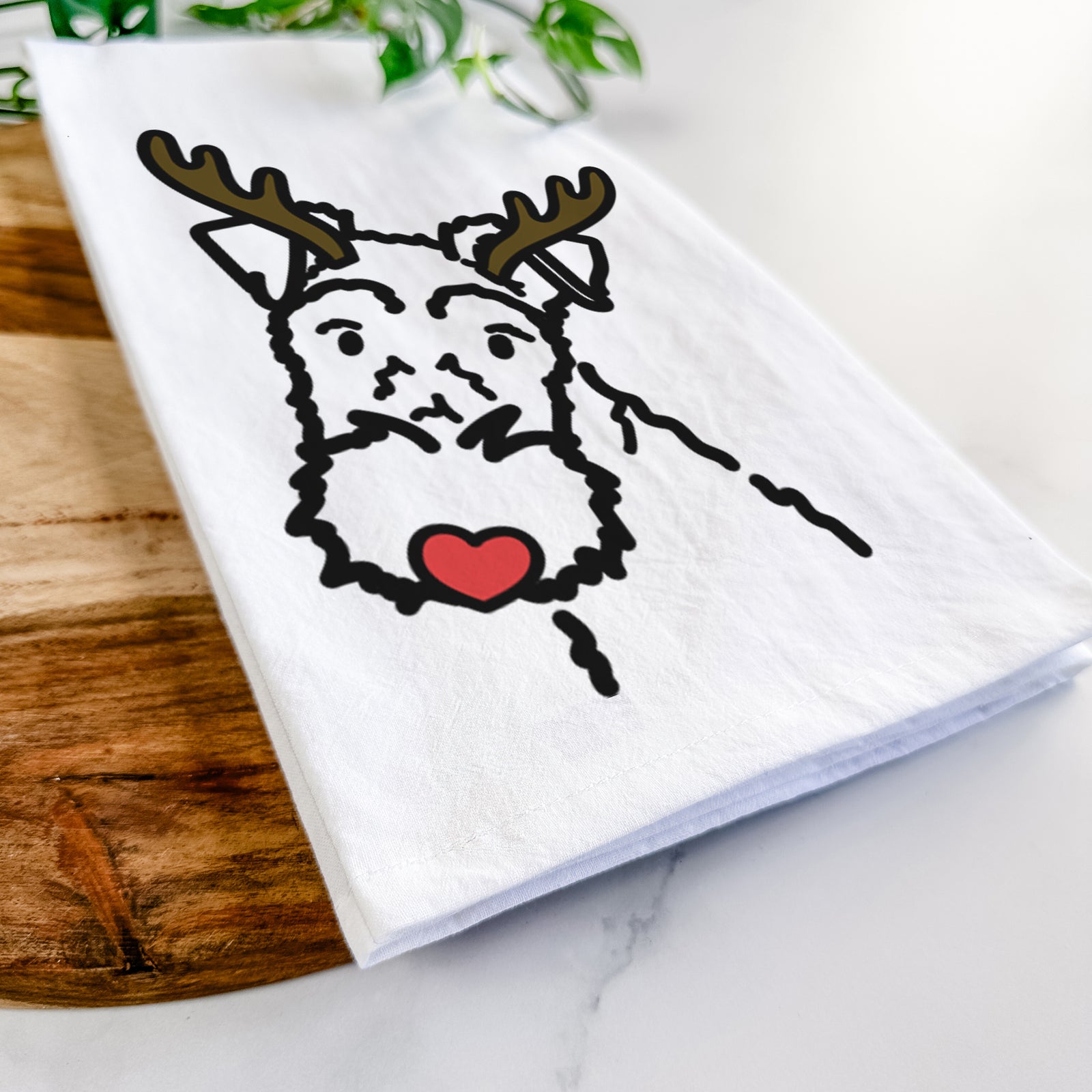 Minimalist line drawing of a Wire Fox Terrier with reindeer antlers and a red nose on a tea towel
