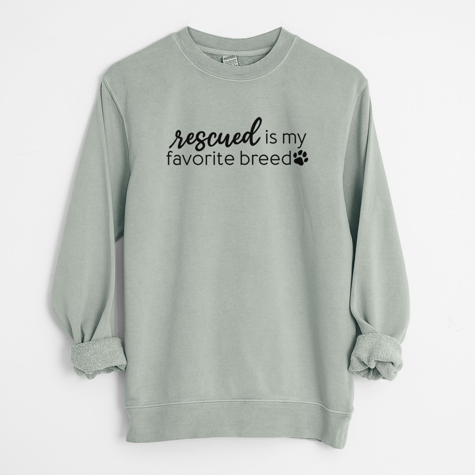'Rescued is My Favorite Breed' design on a Sage Unisex pigment dyed crew sweatshirt