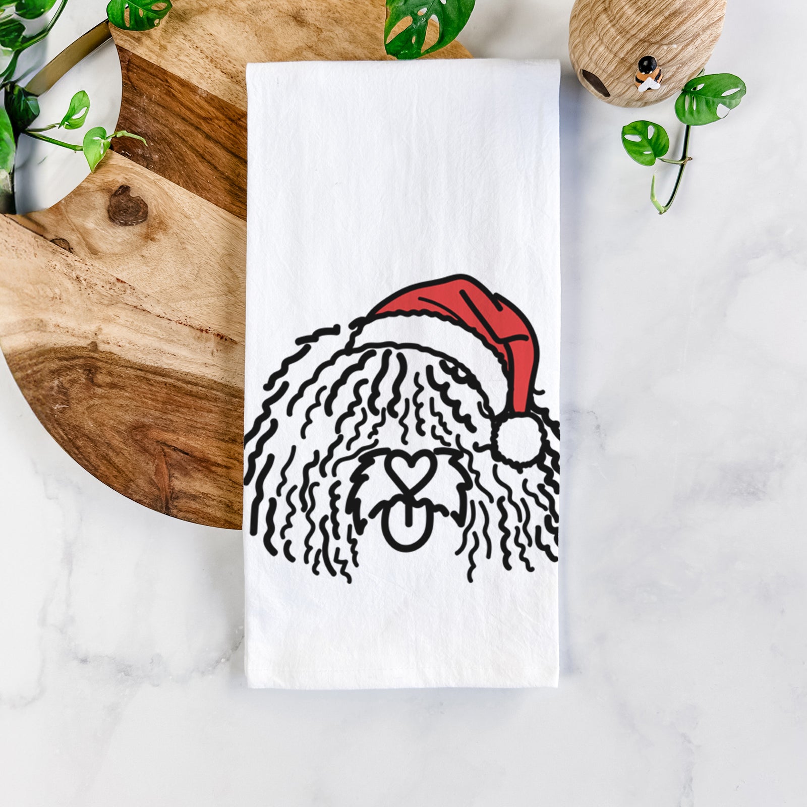 Minimalist line drawing of Alba the Spanish Water Dog wearing a Santa hat on a tea towel