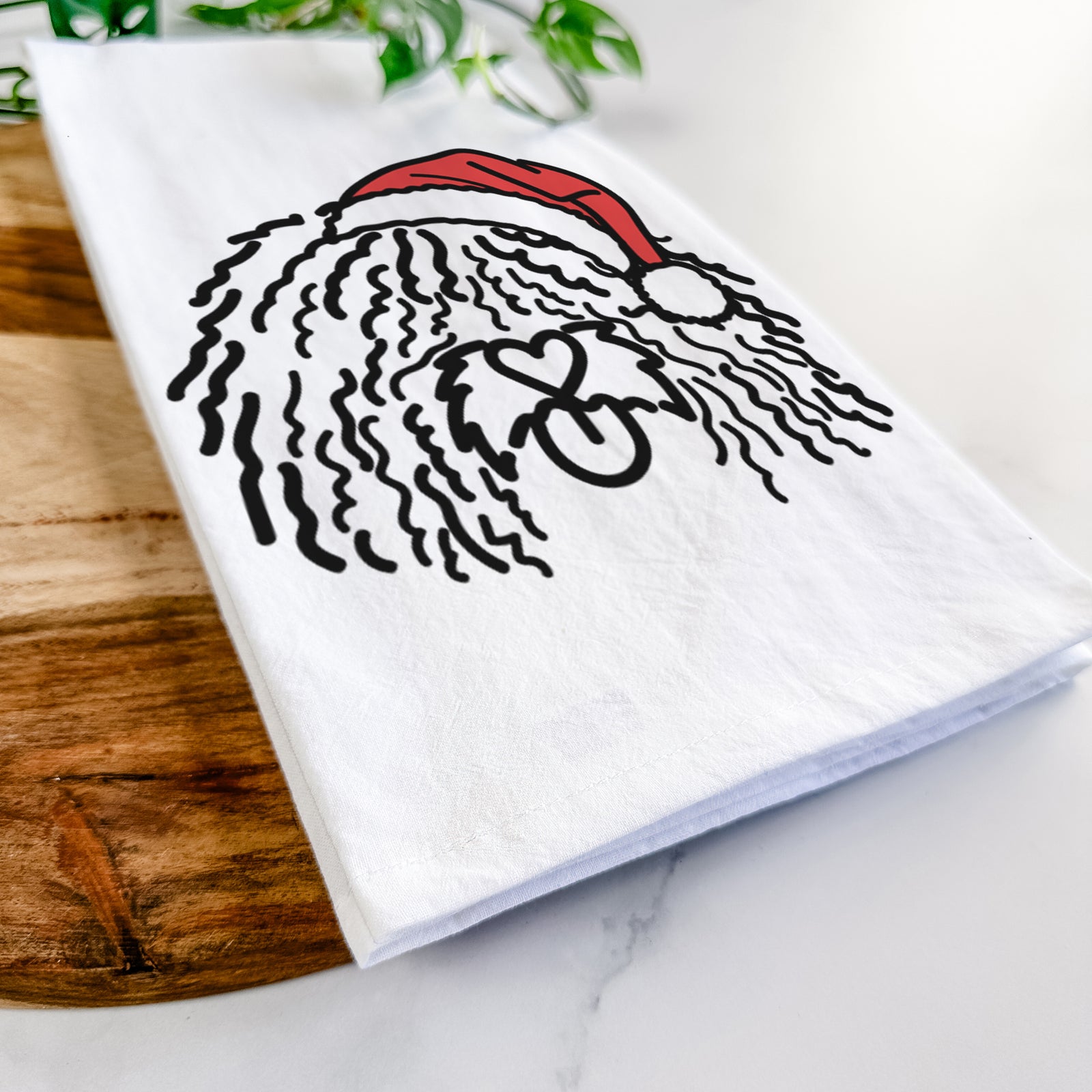 Minimalist line drawing of Alba the Spanish Water Dog wearing a Santa hat on a tea towel