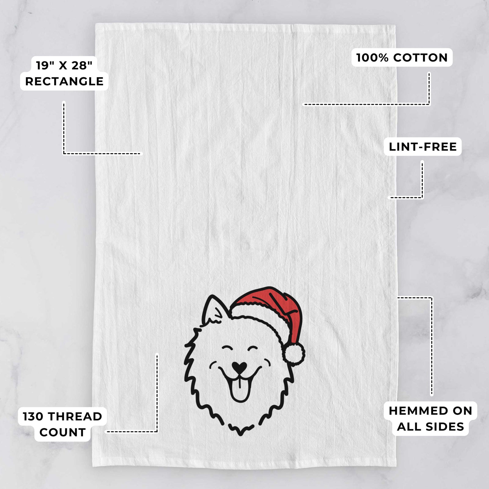 Minimalist line drawing of an American Eskimo wearing a Santa hat on a tea towel, with feature callouts: 19 x 28 inch rectangle, 100% cotton, lint-free, 120 thread count, hemmed on all sides