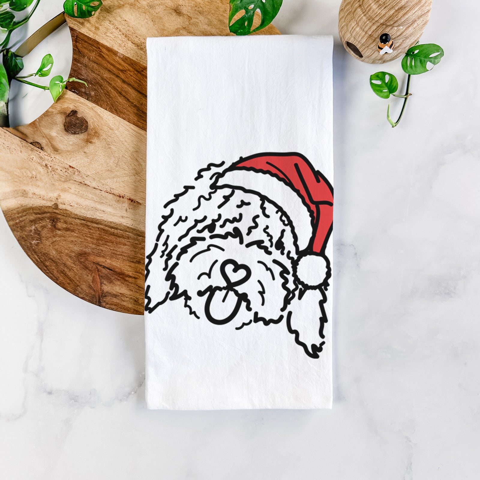 Minimalist line drawing of Antonio the Spanish Water Dog wearing a Santa hat on a tea towel