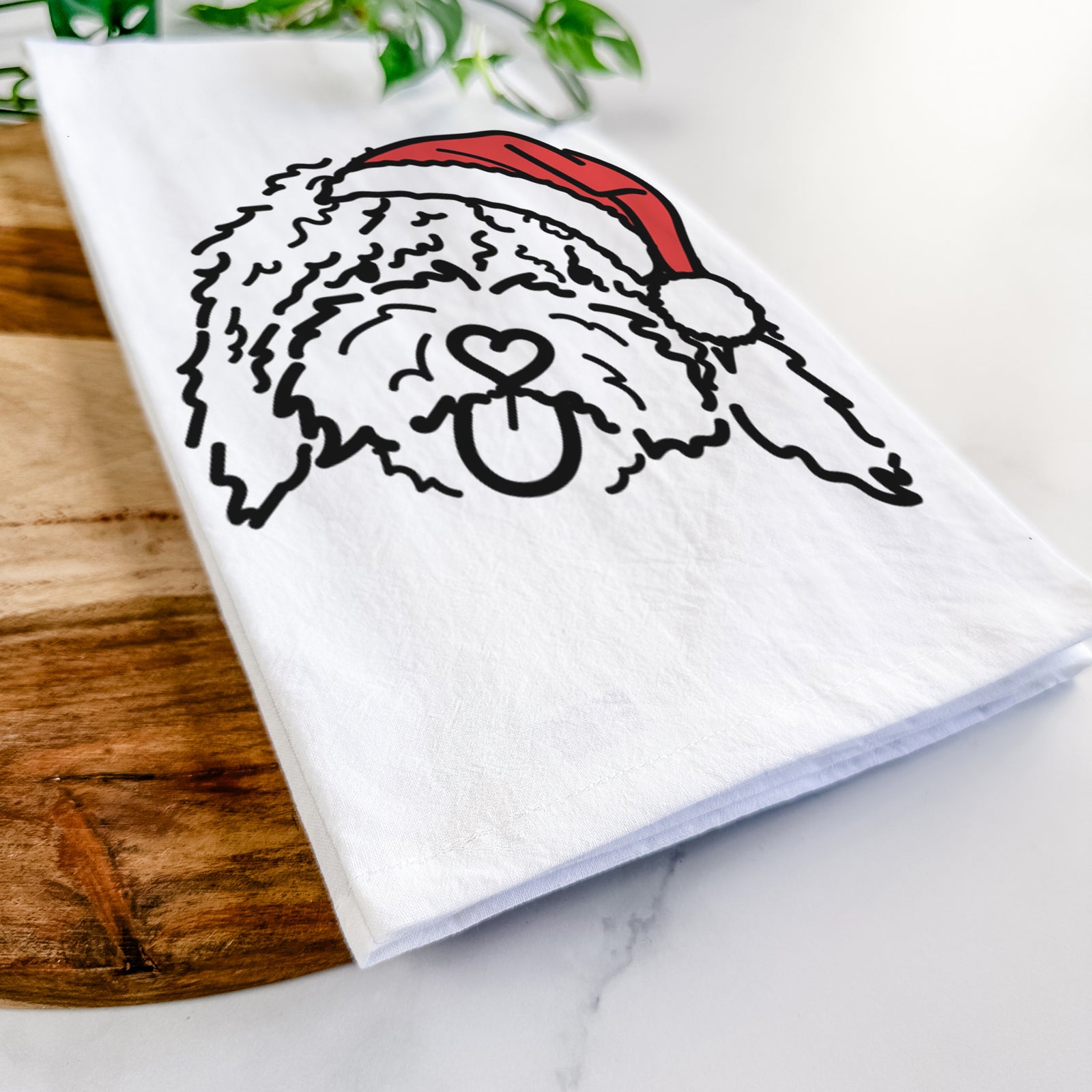 Minimalist line drawing of Antonio the Spanish Water Dog wearing a Santa hat on a tea towel