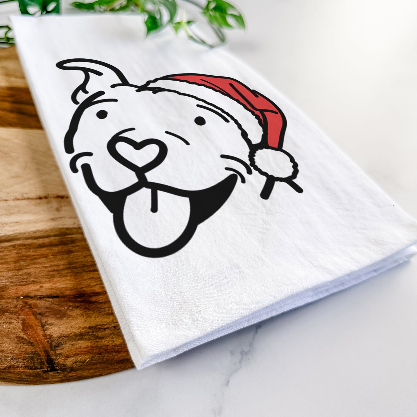 Minimalist line drawing of Arlo the Pitbull wearing a Santa hat on a tea towel