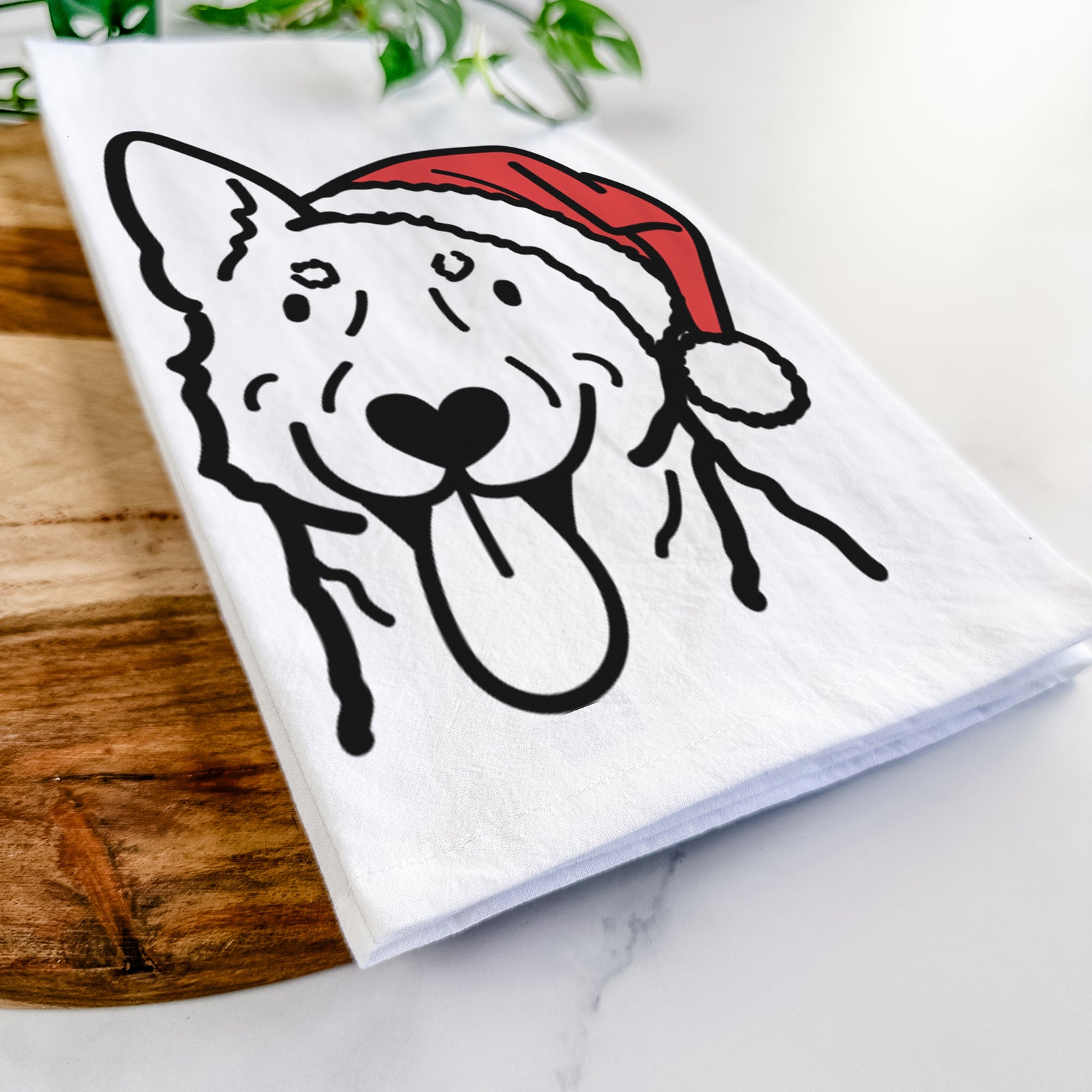 Minimalist line drawing of an Australian Cattle Dog wearing a Santa hat on a tea towel