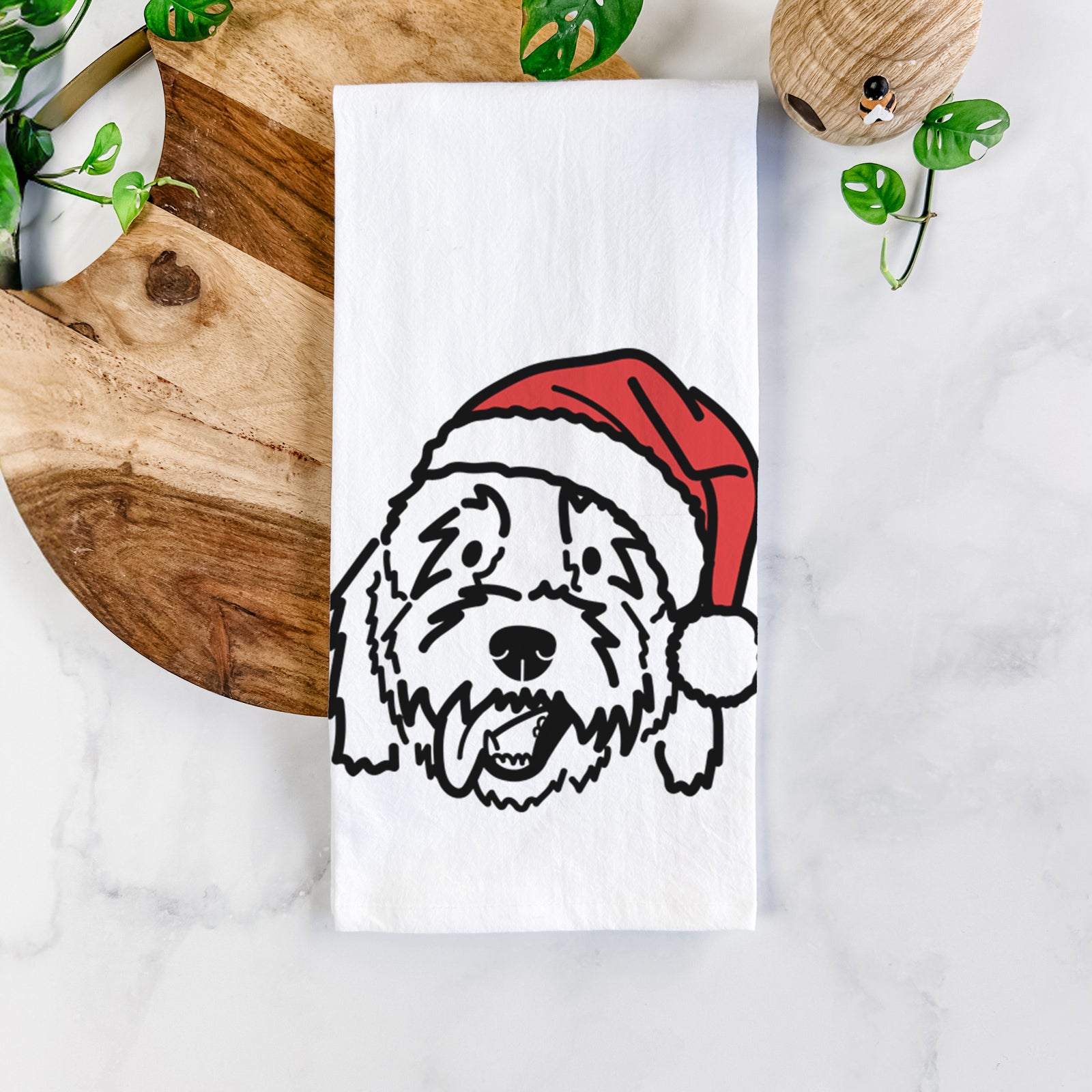 Minimalist line drawing of Barry the Goldendoodle wearing a Santa hat on a tea towel