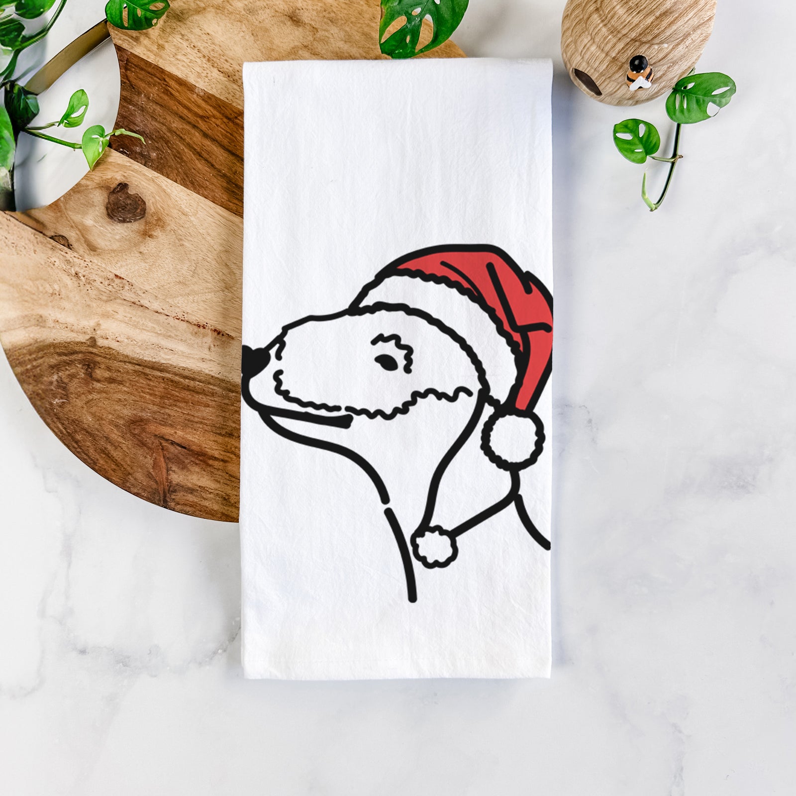 Minimalist line drawing of a Bedlington Terrier wearing a Santa hat on a tea towel
