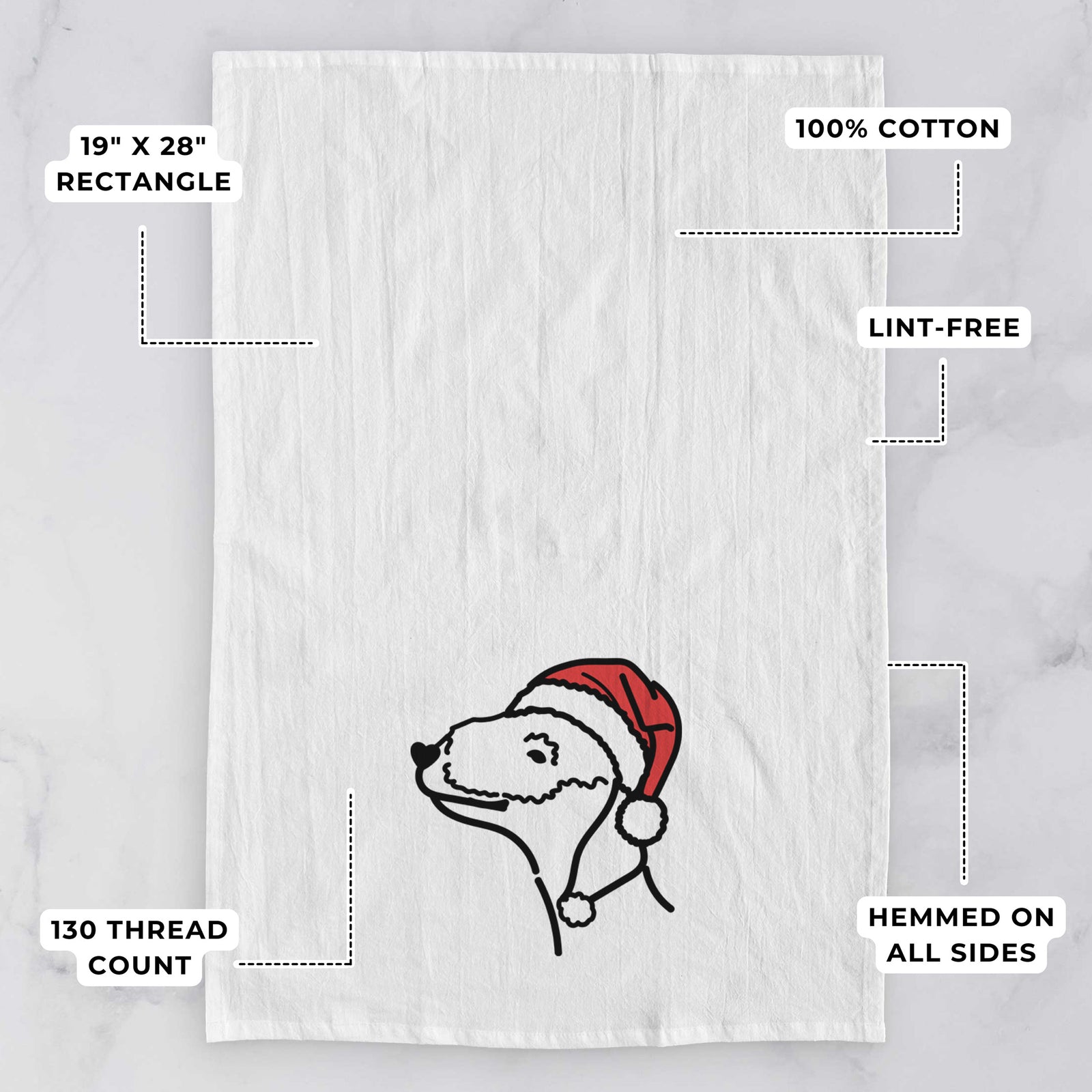 Minimalist line drawing of a Bedlington Terrier wearing a Santa hat on a tea towel, with feature callouts: 19 x 28 inch rectangle, 100% cotton, lint-free, 120 thread count, hemmed on all sides