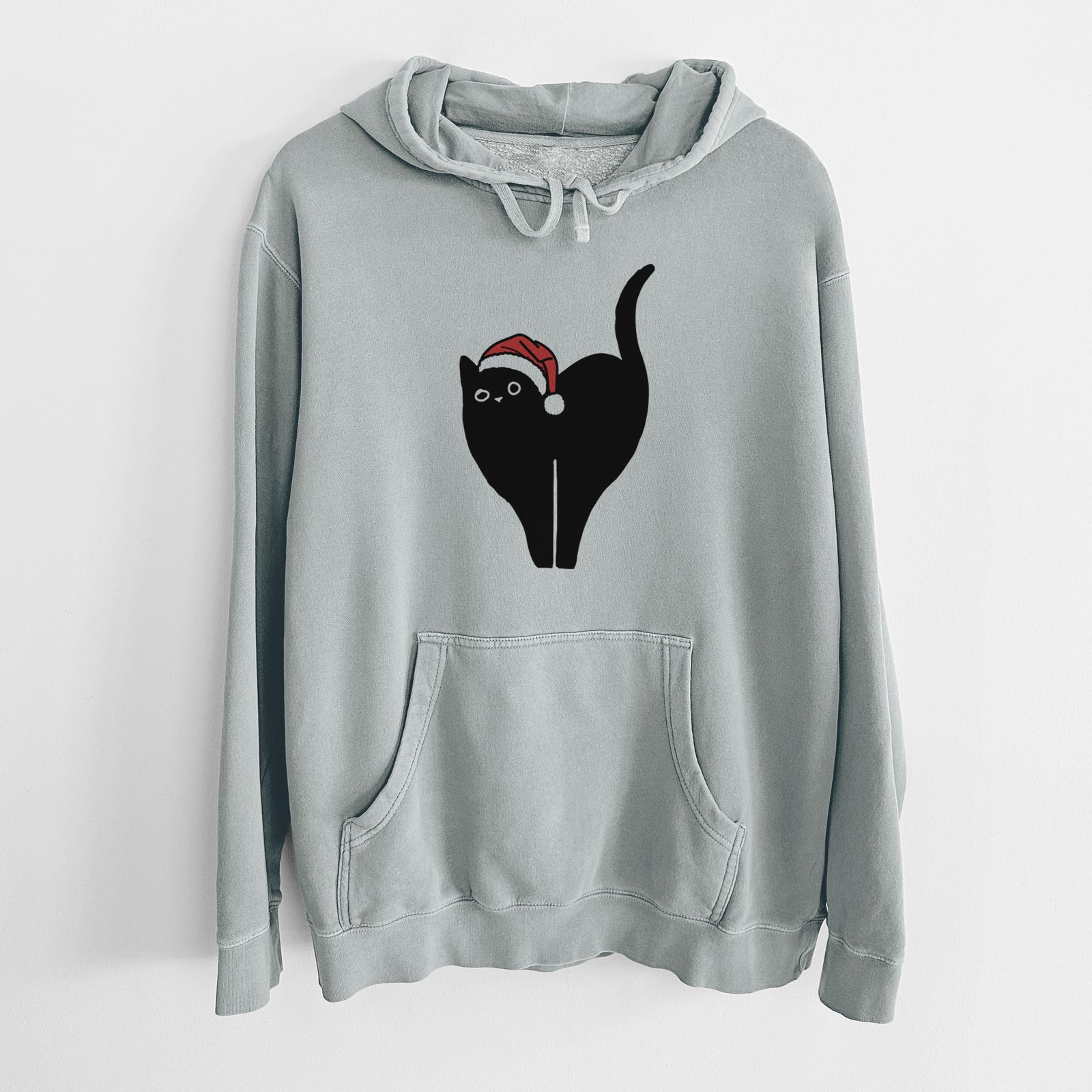 Minimalist line drawing of Bella the Black Cat wearing a Santa hat on a Sage Unisex pigment dyed hoodie