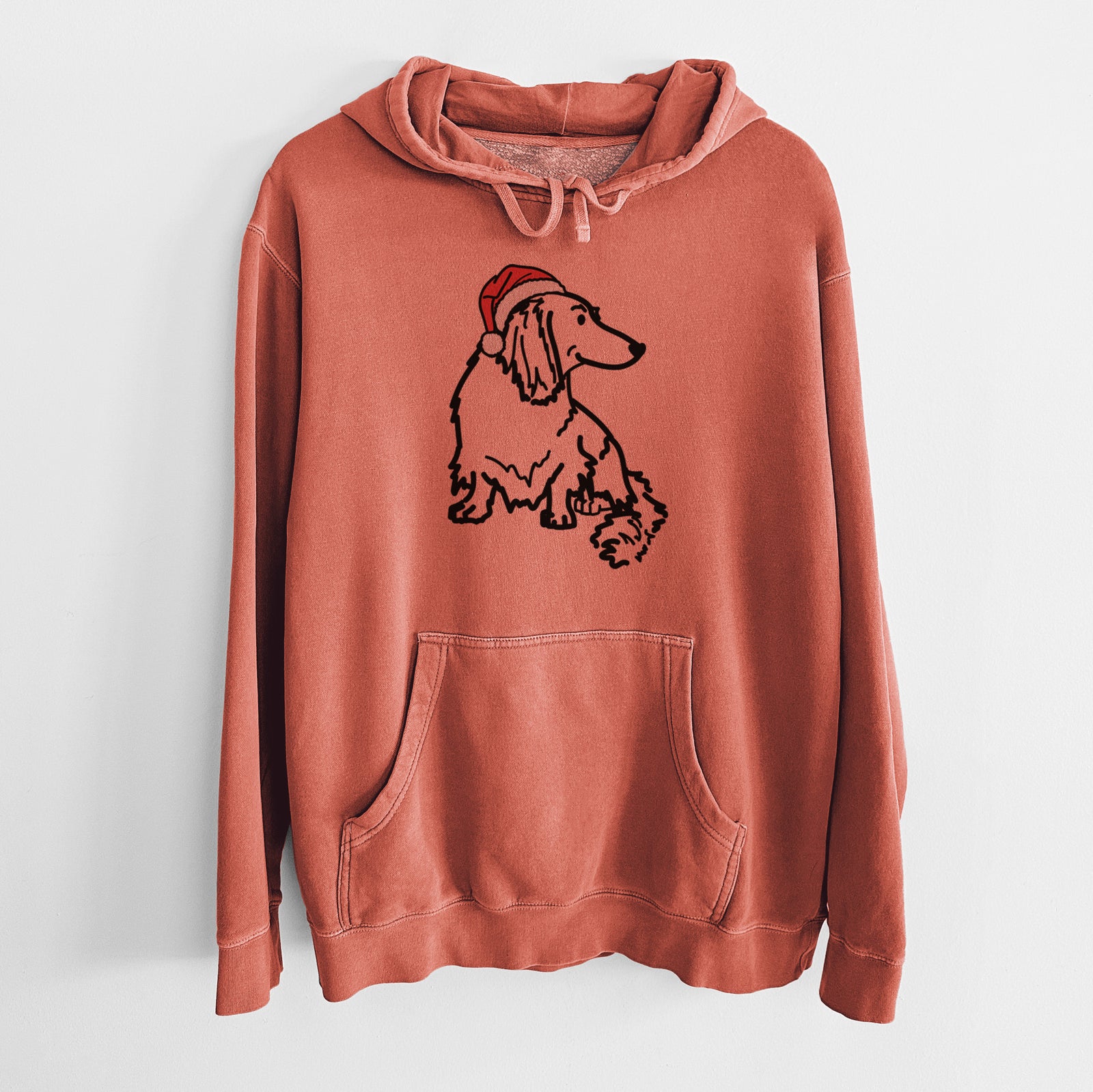 Minimalist line drawing of Bella the Dachshund wearing a Santa hat on an Amber Unisex pigment dyed hoodie