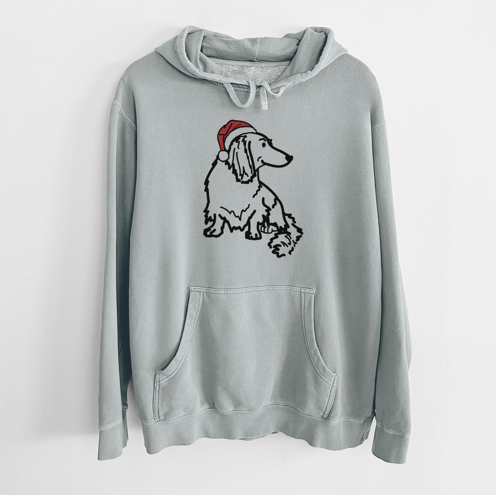 Minimalist line drawing of Bella the Dachshund wearing a Santa hat on a Sage Unisex pigment dyed hoodie