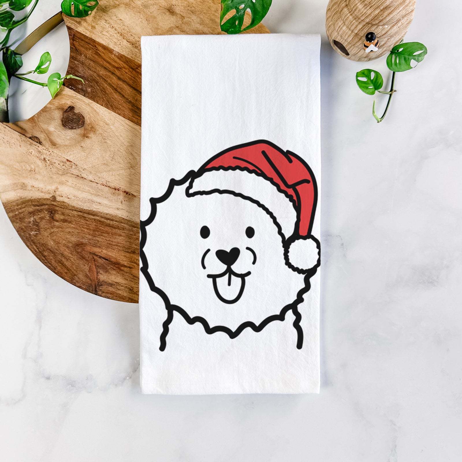 Minimalist line drawing of a Bichon Frise wearing a Santa hat on a tea towel