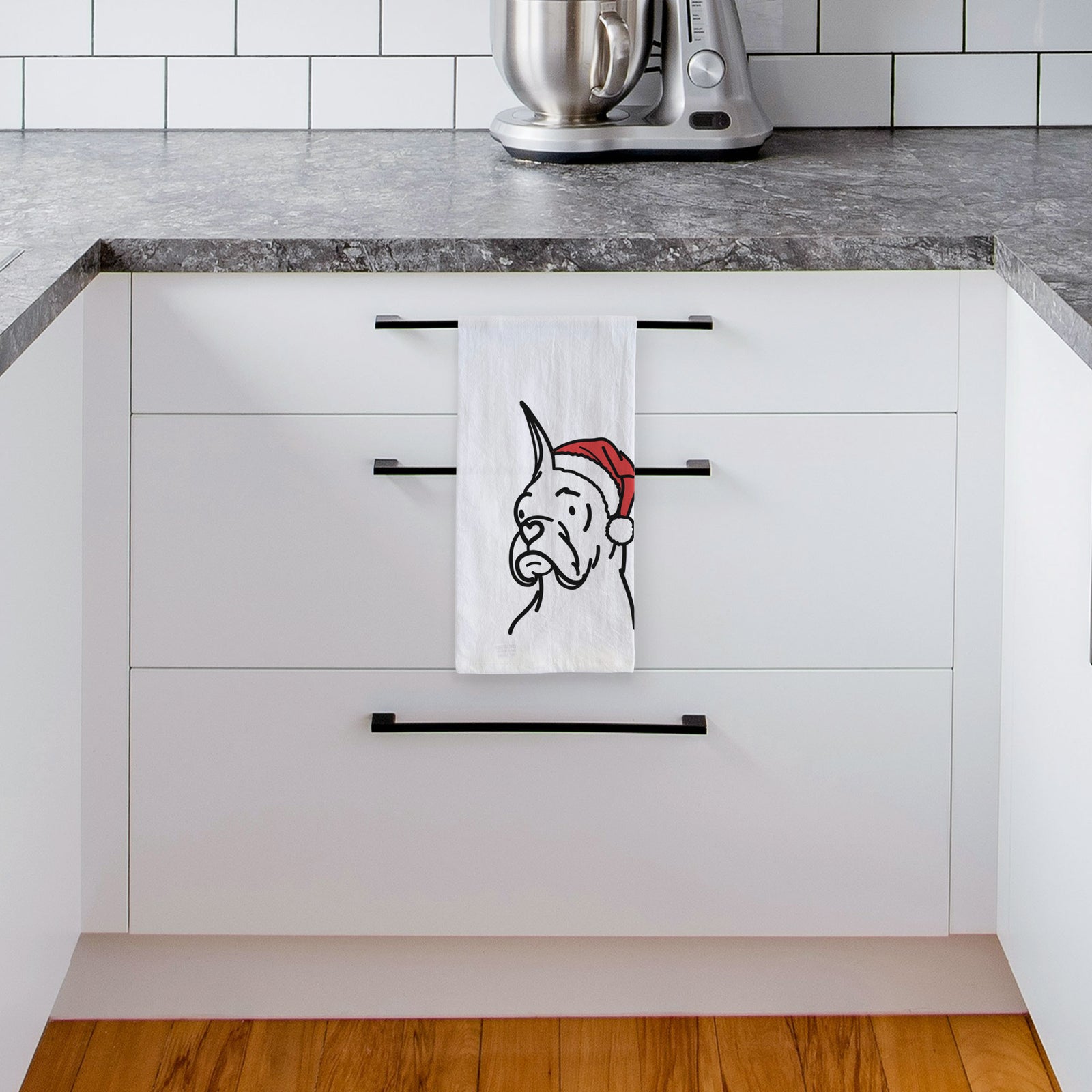 Minimalist line drawing of Billy the Rescue Boxer wearing a Santa hat on a tea towel, hanging on an oven door in a kitchen