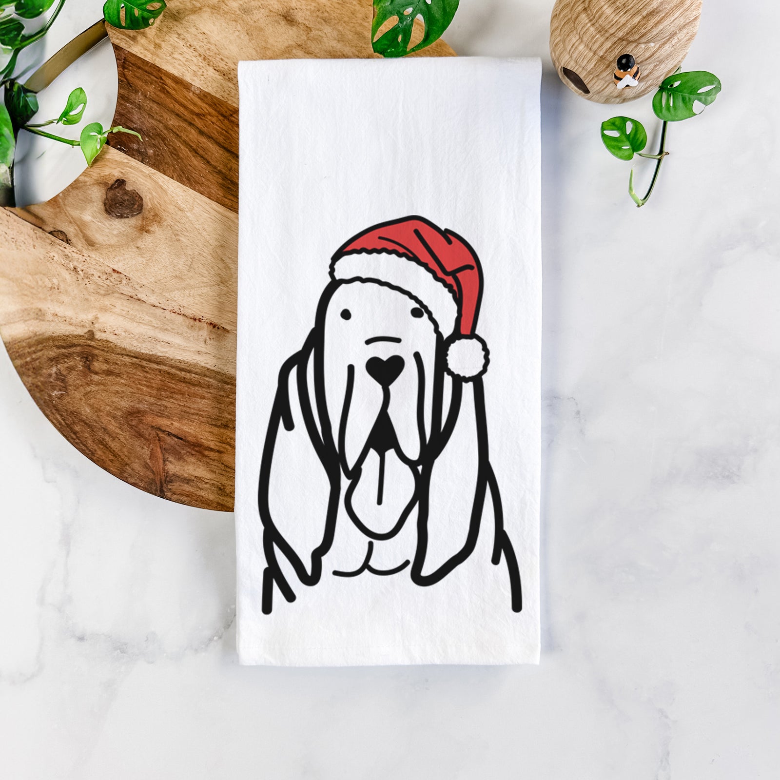 Minimalist line drawing of a Bloodhound wearing a Santa hat on a tea towel