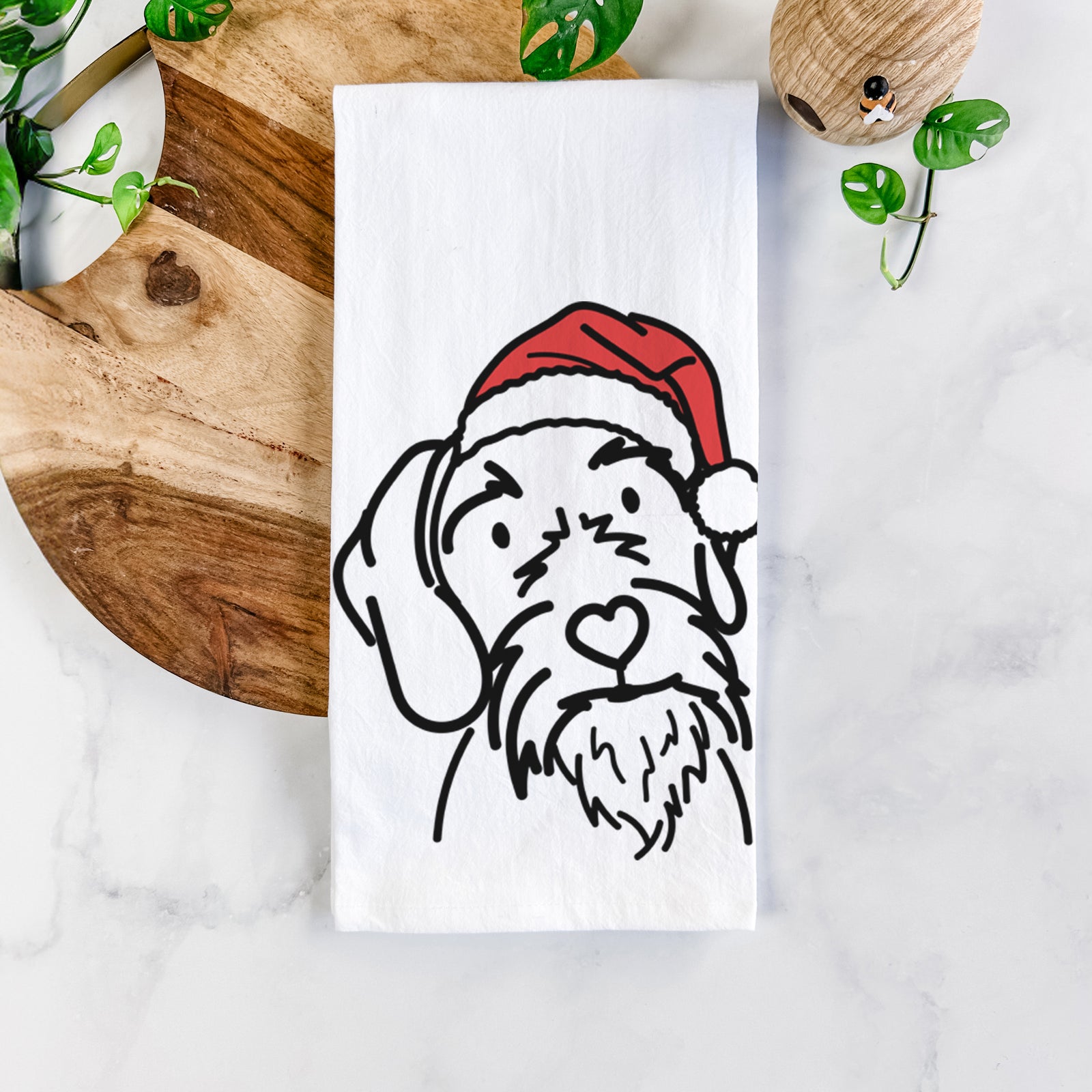 Minimalist line drawing of Buck the German Wirehaired Pointer wearing a Santa hat on a tea towel