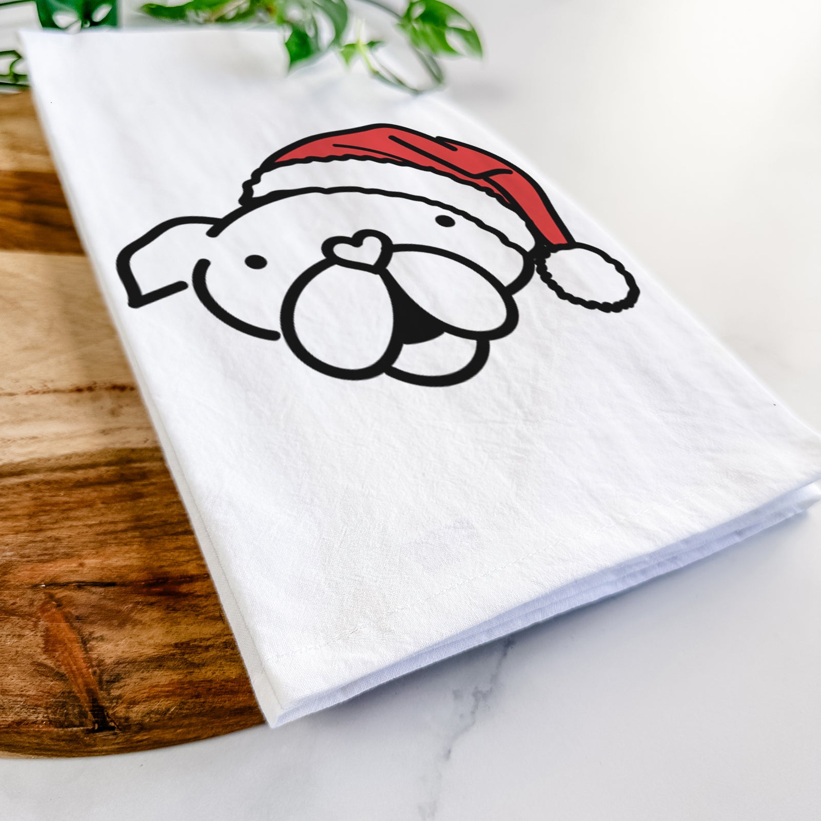 Minimalist line drawing of an English Bulldog wearing a Santa hat on a tea towel