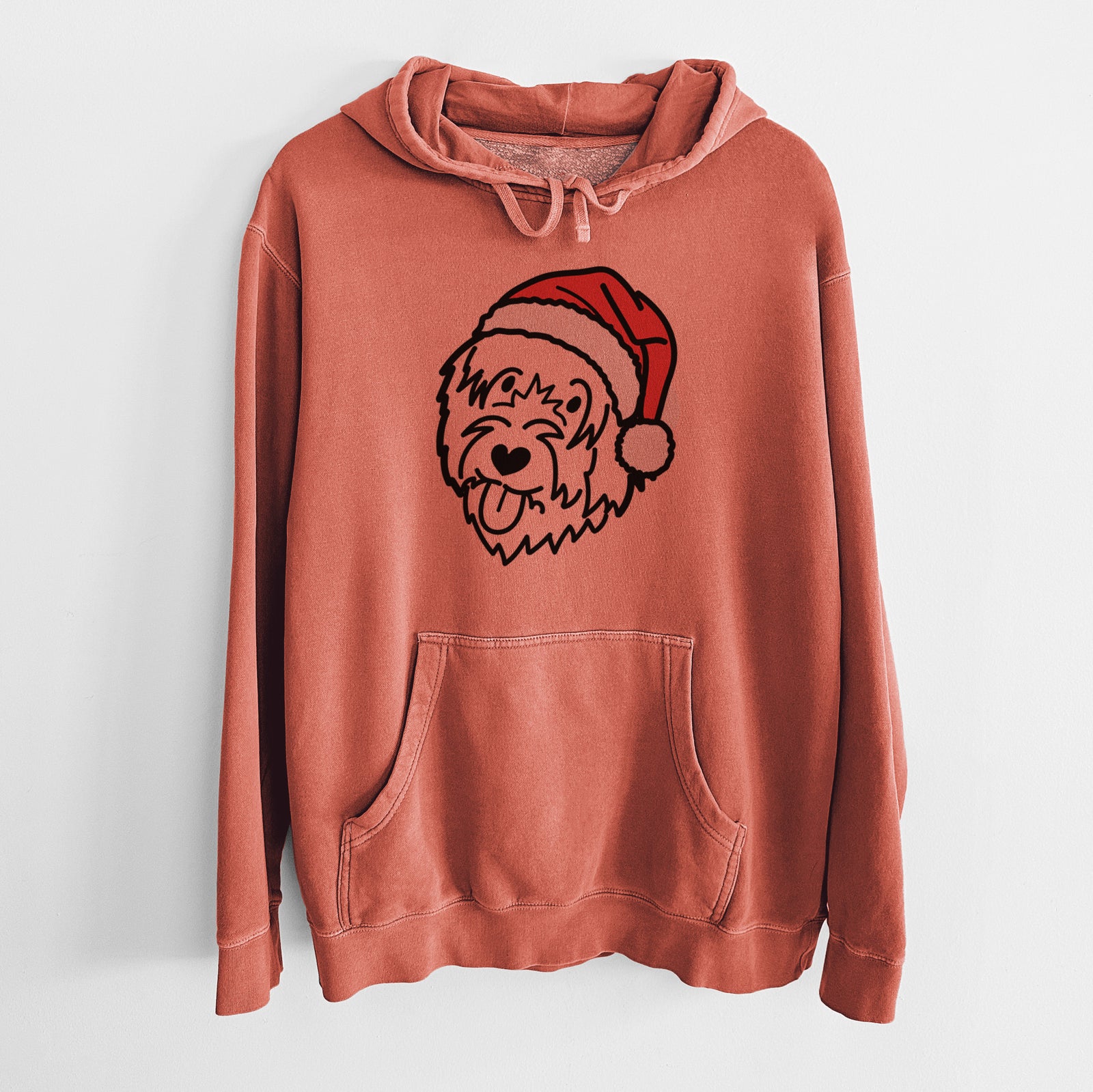 Minimalist line drawing of a Catalan Sheepdog wearing a Santa hat on an Amber Unisex pigment dyed hoodie