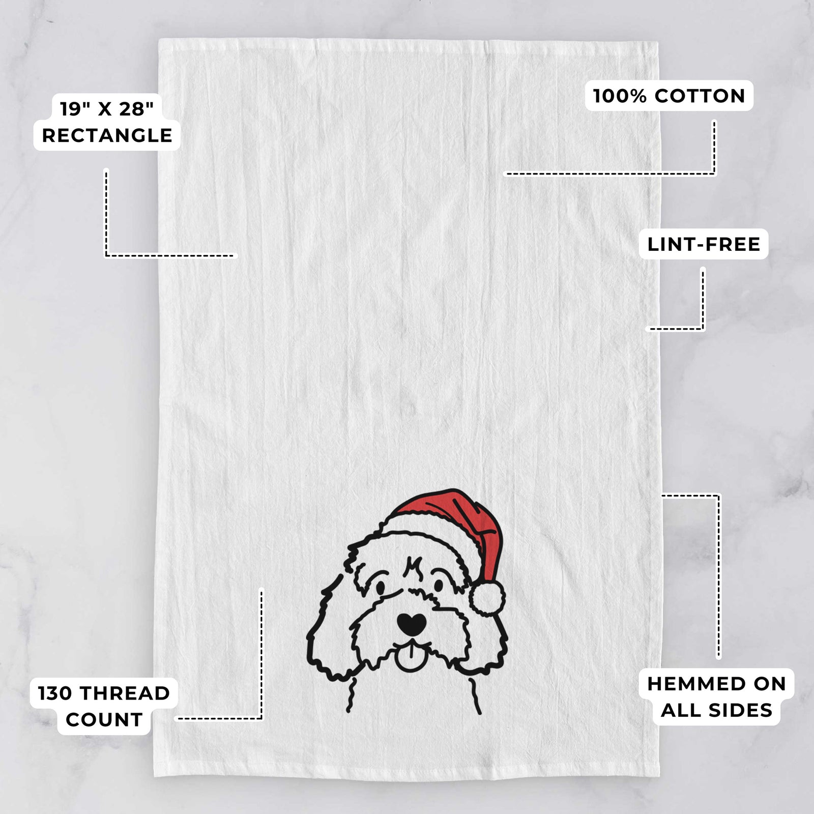 Minimalist line drawing of a Cavapoo wearing a Santa hat on a tea towel, with feature callouts: 19 x 28 inch rectangle, 100% cotton, lint-free, 120 thread count, hemmed on all sides