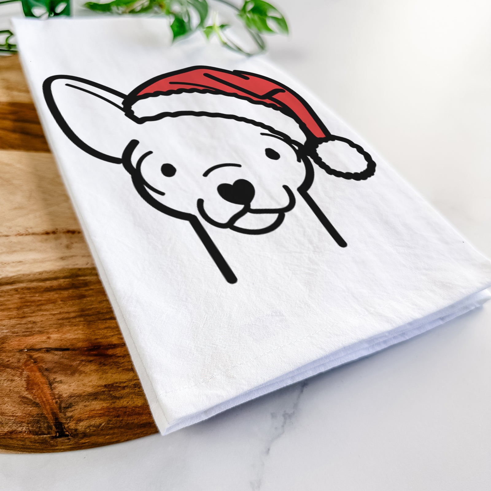 Minimalist line drawing of a Chihuahua wearing a Santa hat on a tea towel