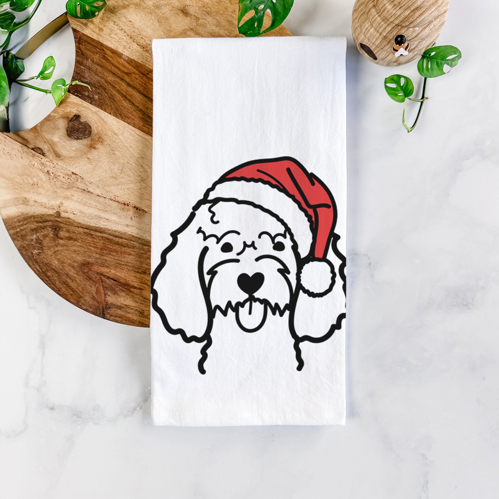 Minimalist line drawing of a Cockapoo wearing a Santa hat on a tea towel