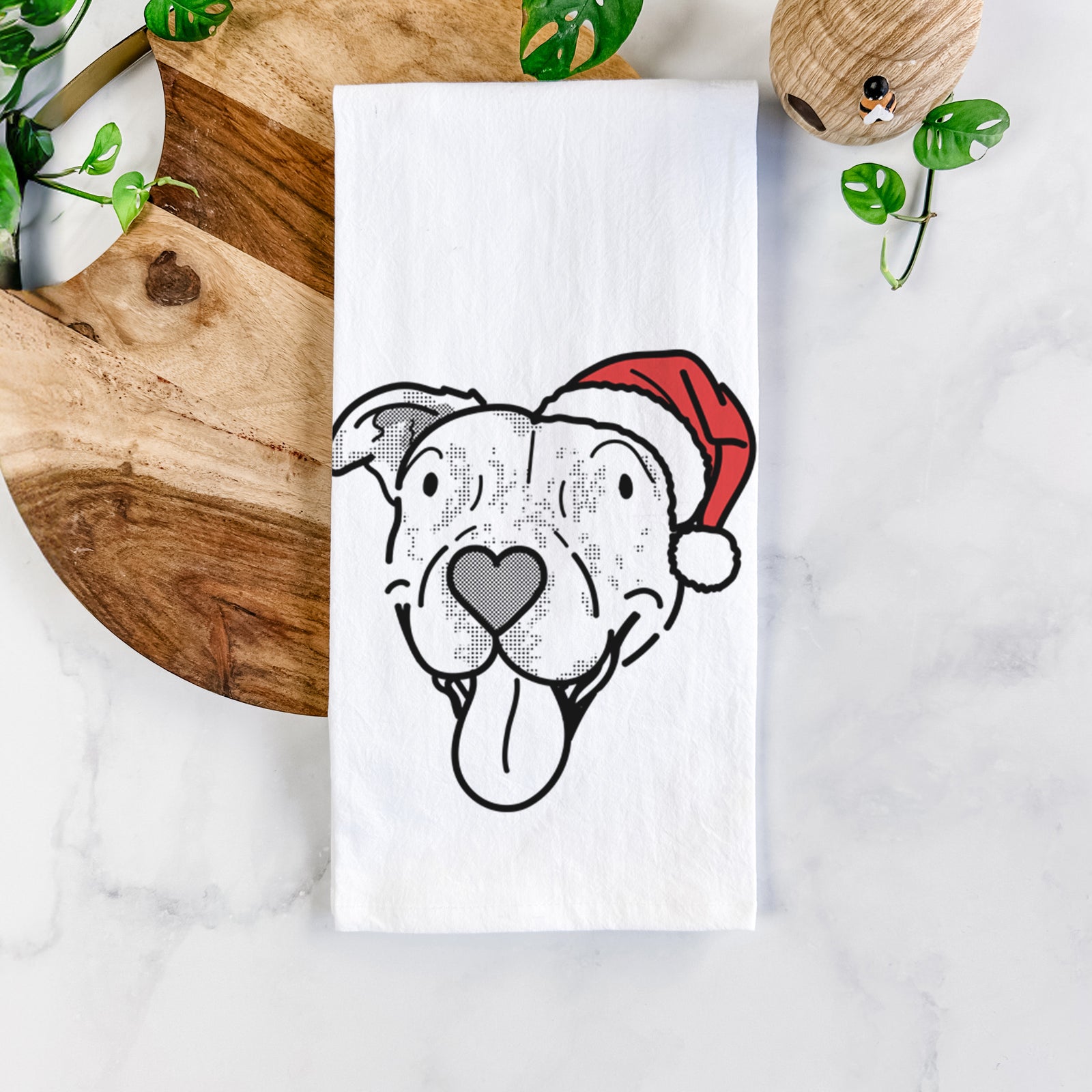 Minimalist line drawing of Dottie the Pitbull Mix wearing a Santa hat on a tea towel