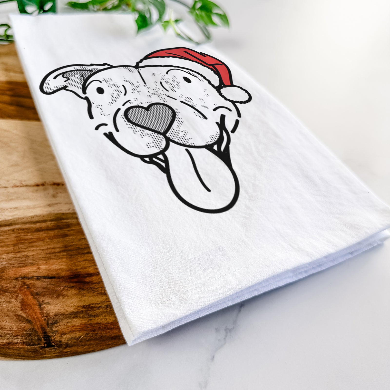 Minimalist line drawing of Dottie the Pitbull Mix wearing a Santa hat on a tea towel